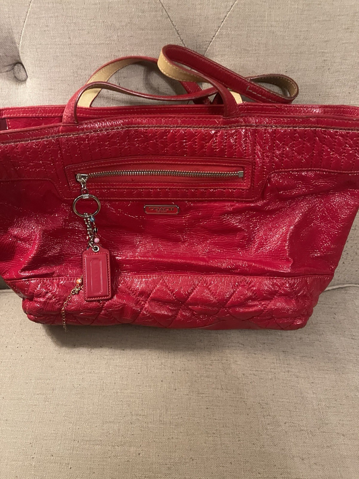 Coach Poppy Daisy Liquid Gloss tote bag, featuring quilted red patent leather