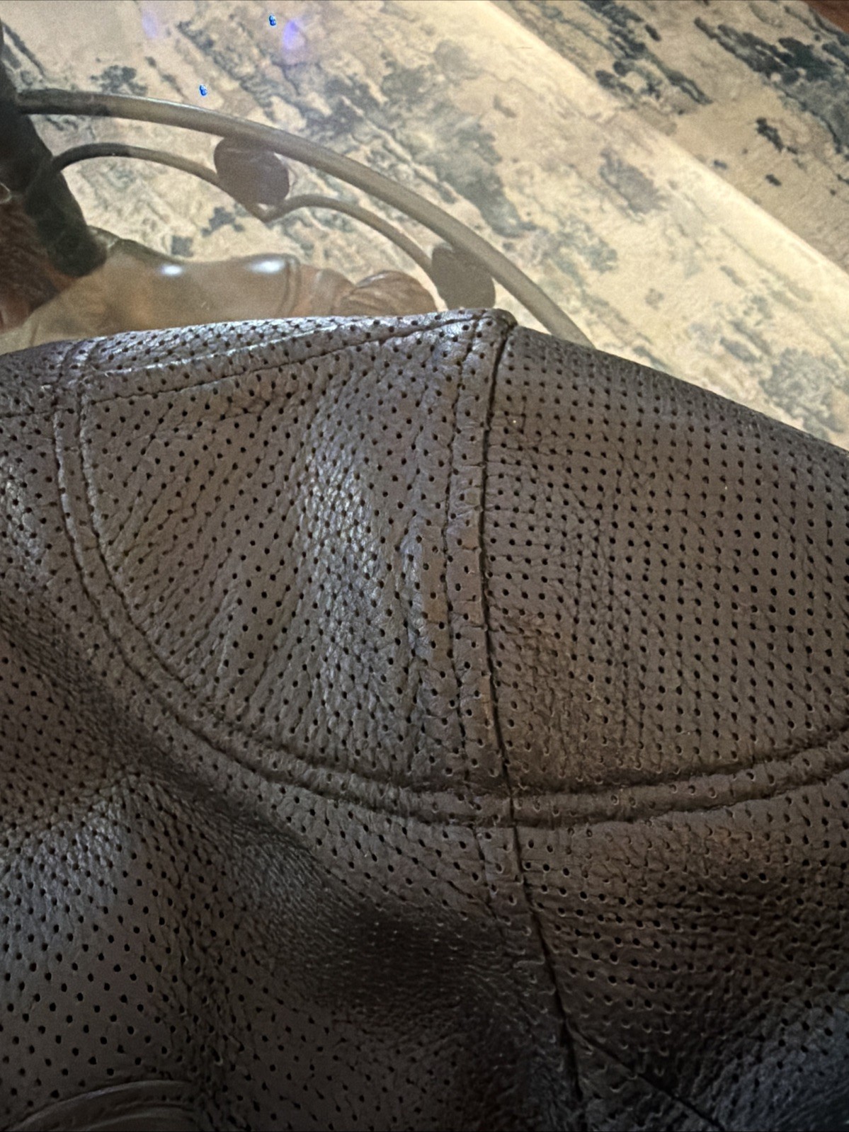 Kushitani leather biker jacket features a perforated design for airflow.