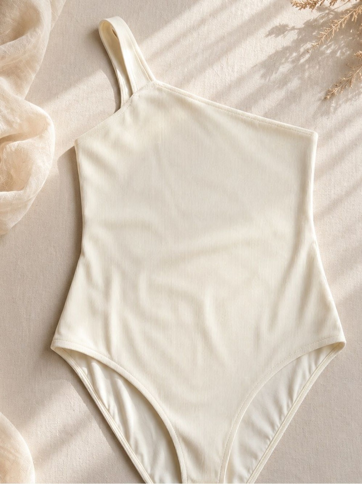 Gauge81 Cream One-Piece Asymmetrical Strap Bodysuit