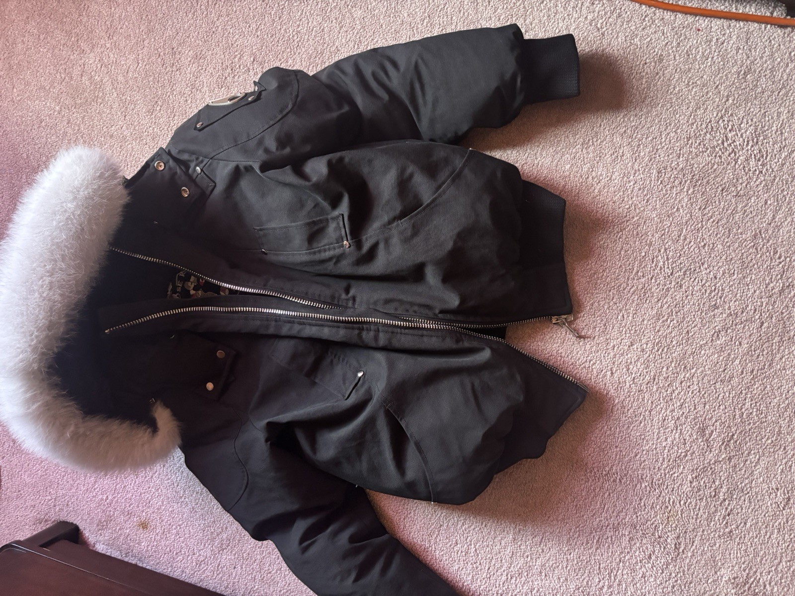 Moose Knuckles women’s black fur-trim hooded zip mid-length parka coat logo