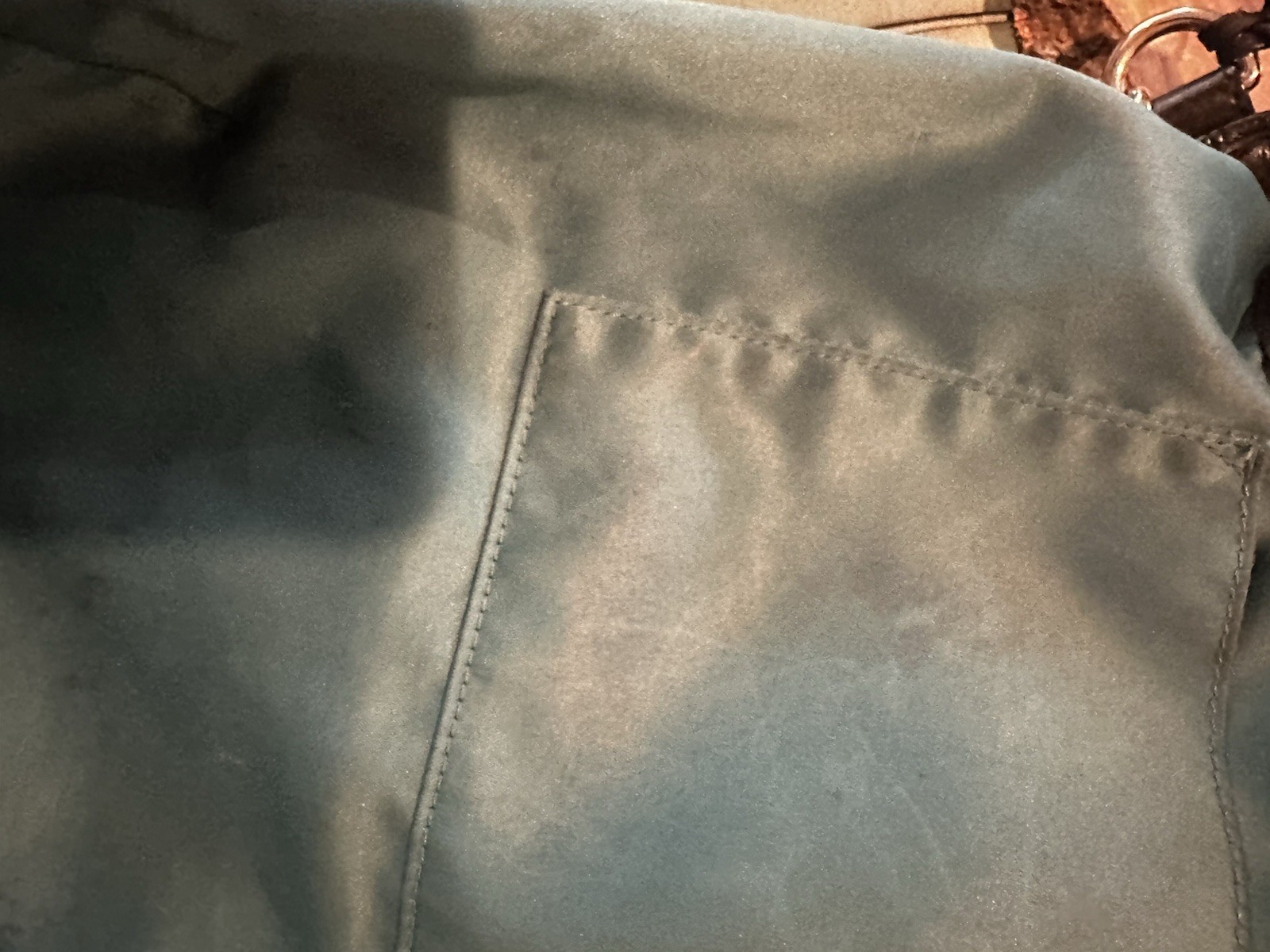Coach Avery bucket bag. Drawstring closure and silver-tone hardware.