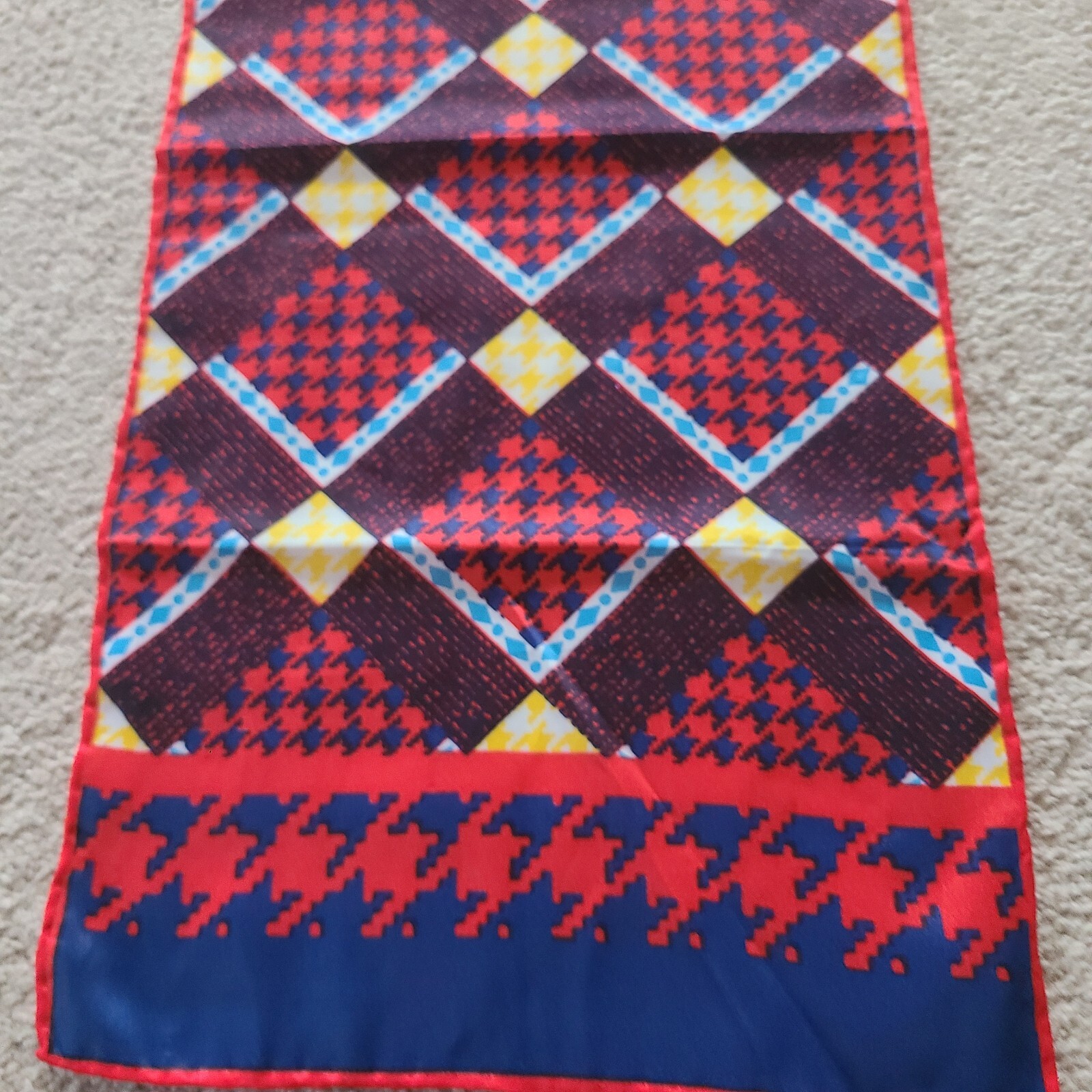 Scarf rectangular geometric pattern in red blue. Unmarked. 43 x 9.75 in.