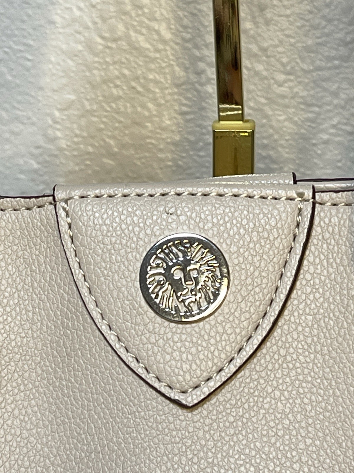 Anne Klein Taupe Vegan Pebbled Texture Tote with Lion and Tassel Charms