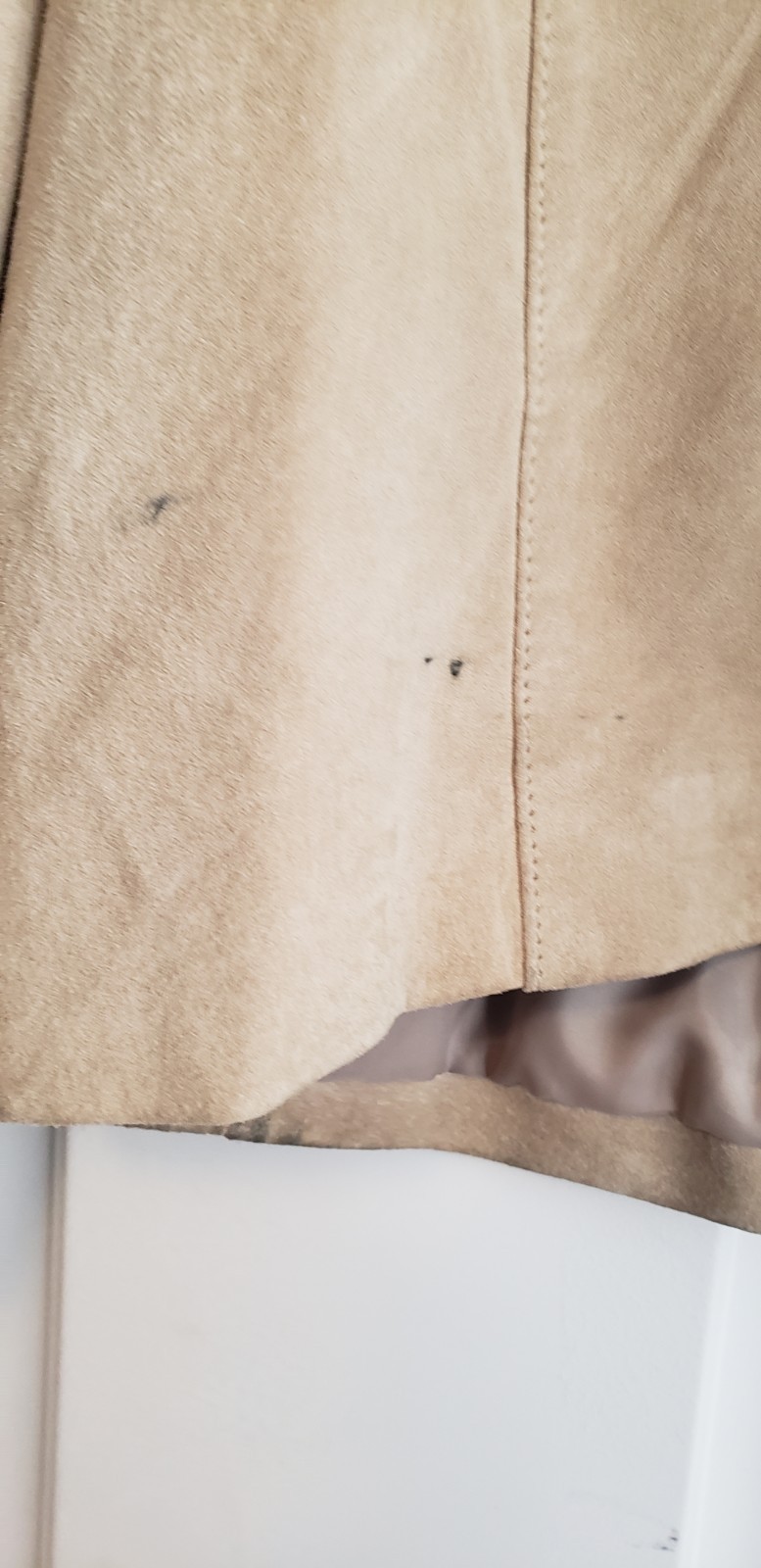 Merona beige collarless suede jacket. It features a minimalist, open-front…