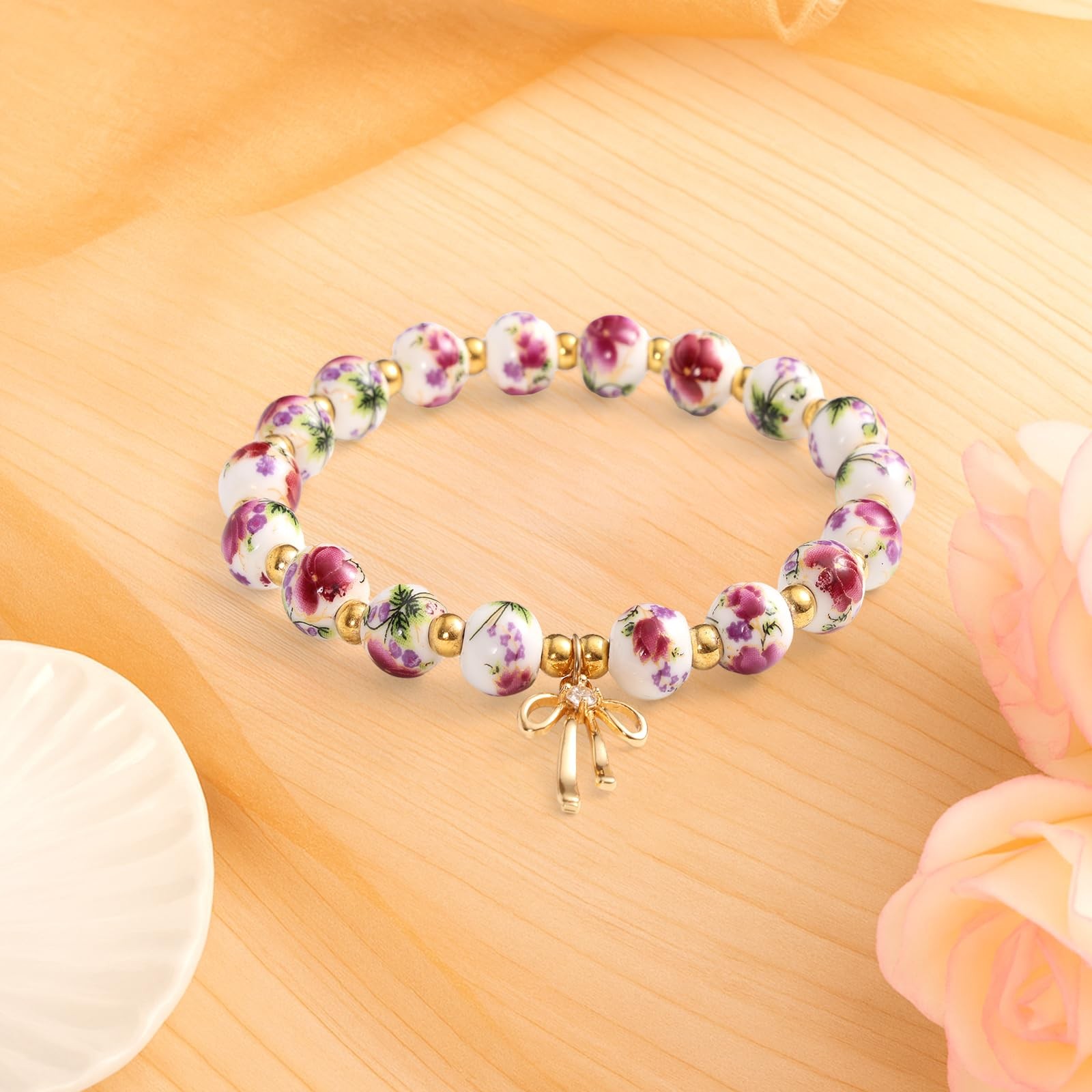 Mikovivi Beads Bow Charm Bracelet Medium, as shown in the detailed picture