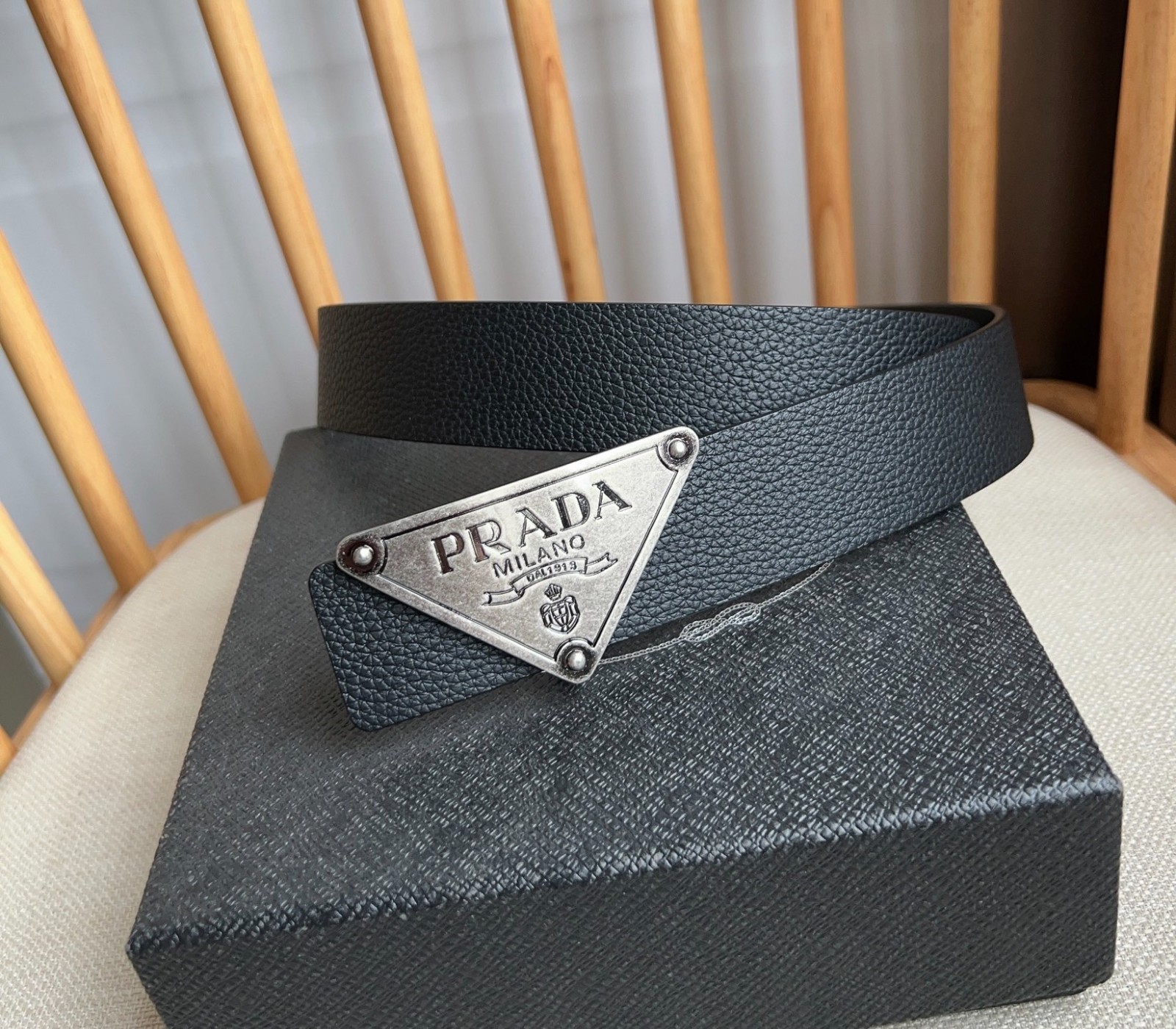 Prada men’s silver-button black leather belt