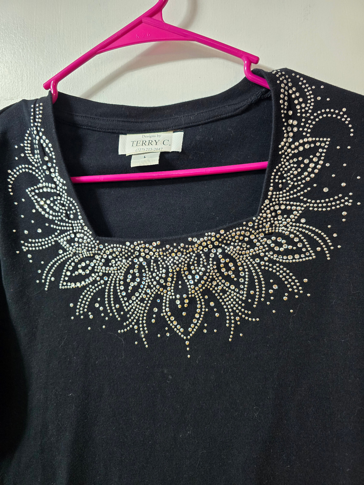 Women’s L Black Top with Metal Dots design around color EUC