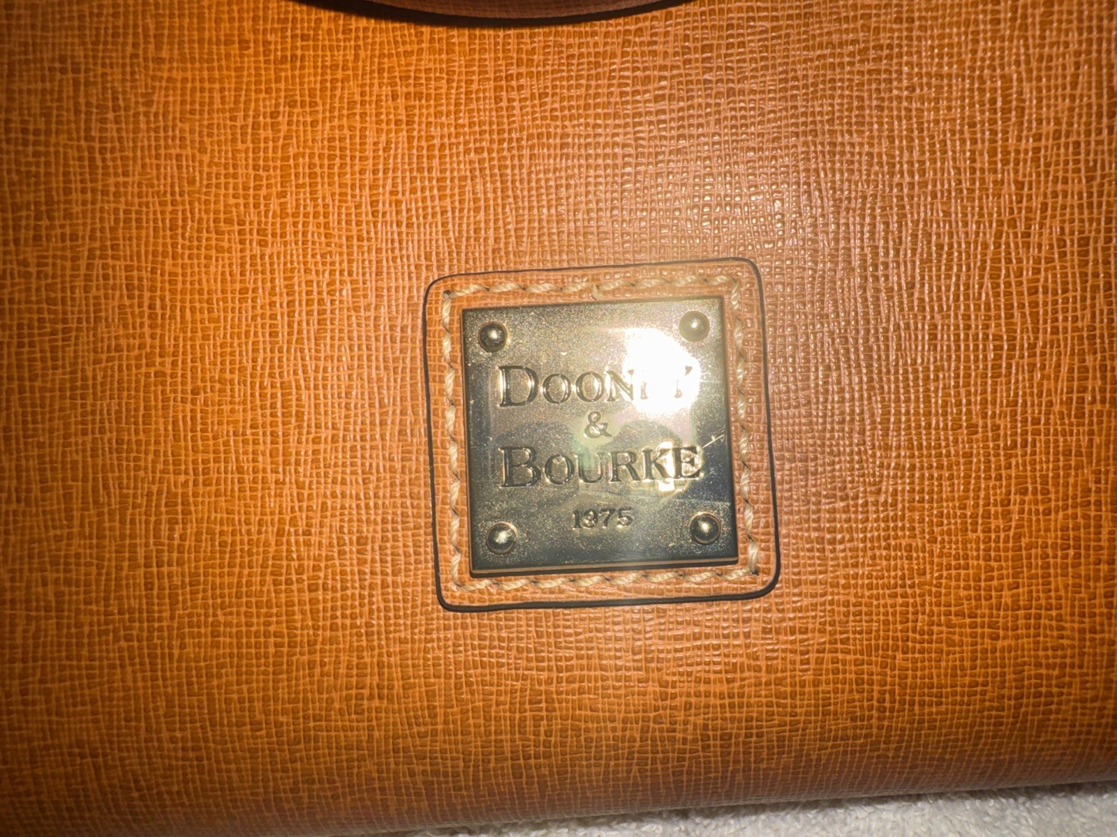 Dooney and Bourke 1975 Saffiano Leather Sydney Satchel Domed cross body.
