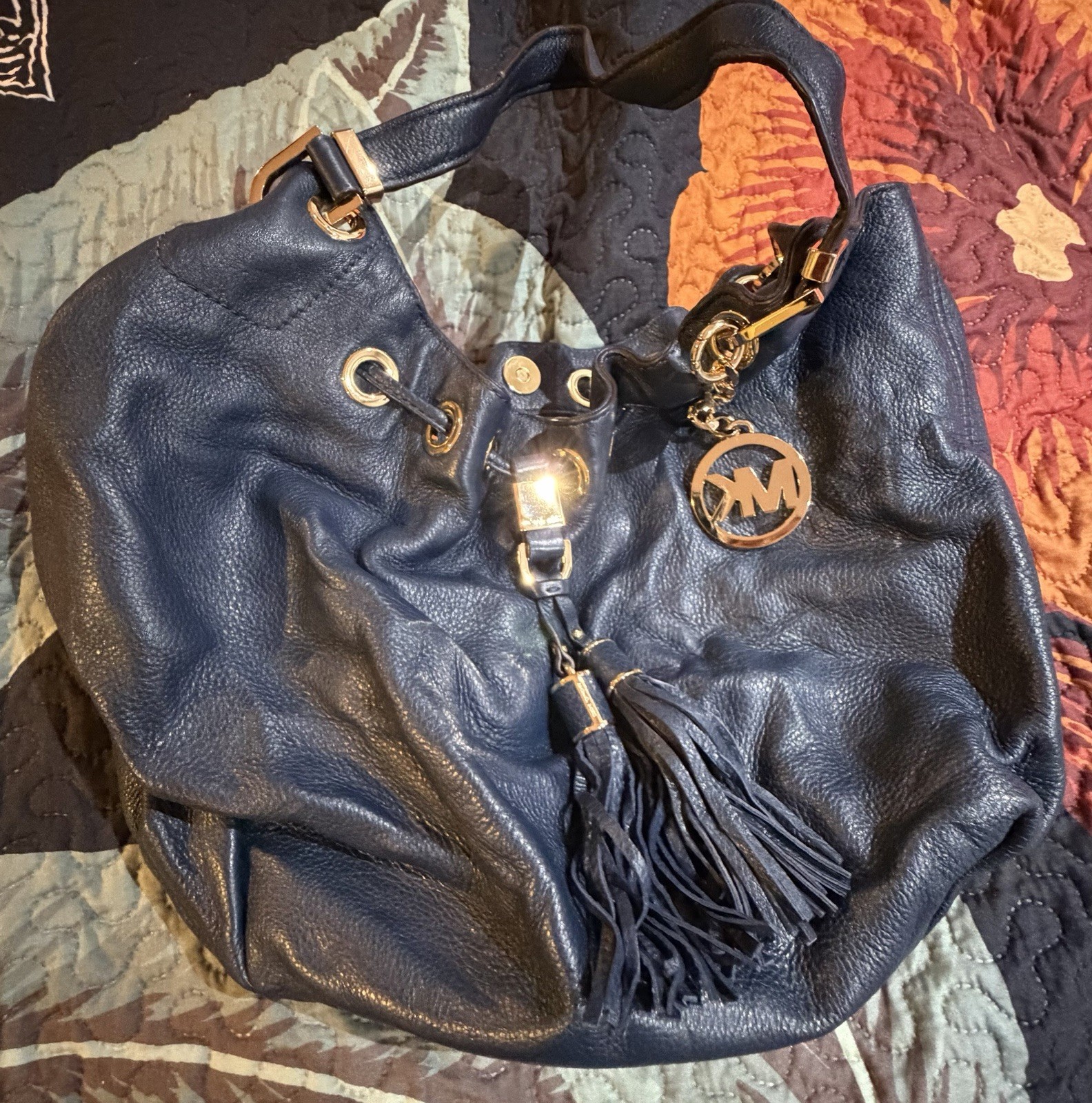 Michael Kors Black Pebbled Hobo Shoulder Bag Drawstring Tassel Logo Charm Gold