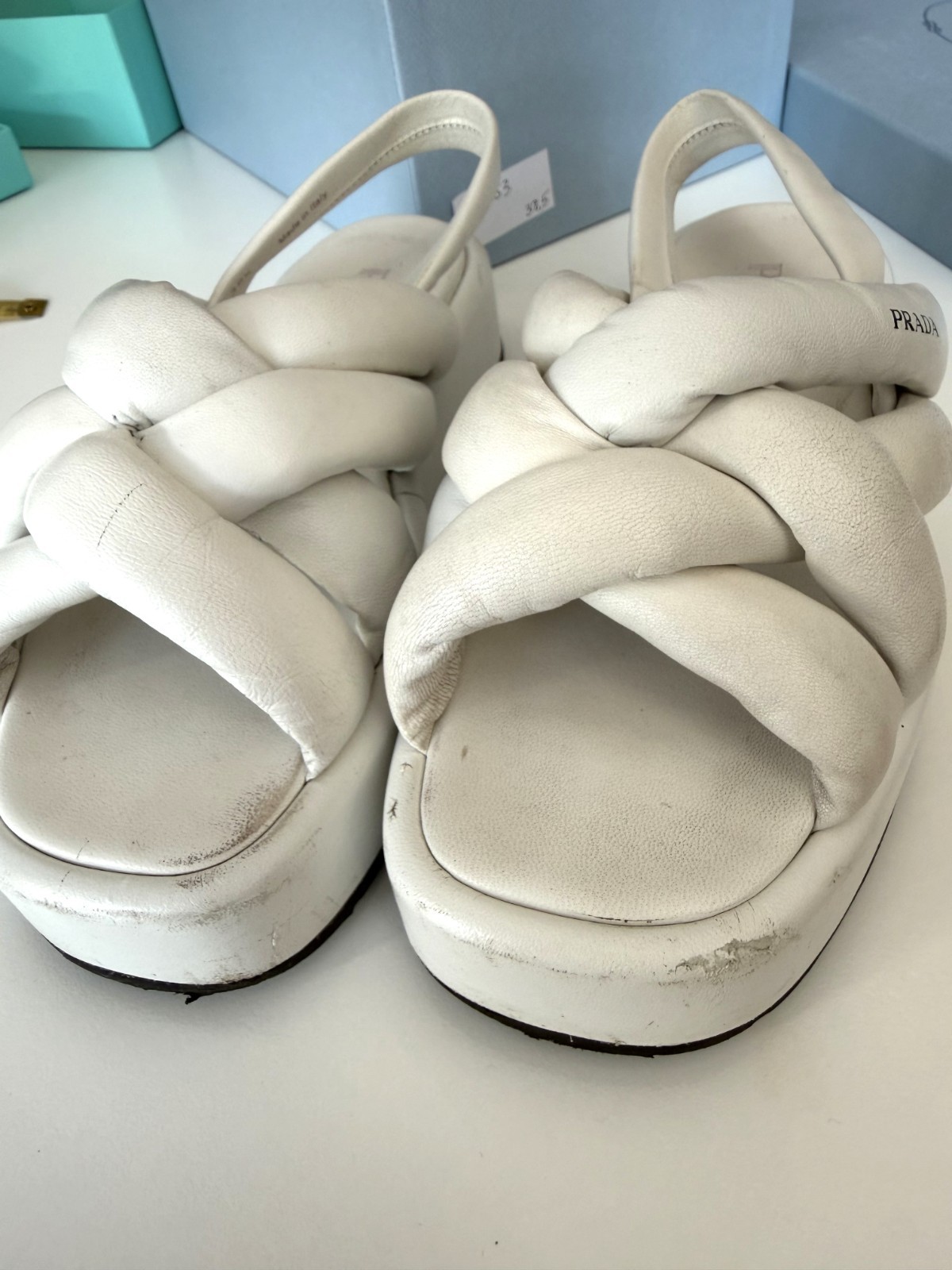 Women’s PRADA Padded Nappa Leather Flatform Sandals in white. Size: 38.5 EU