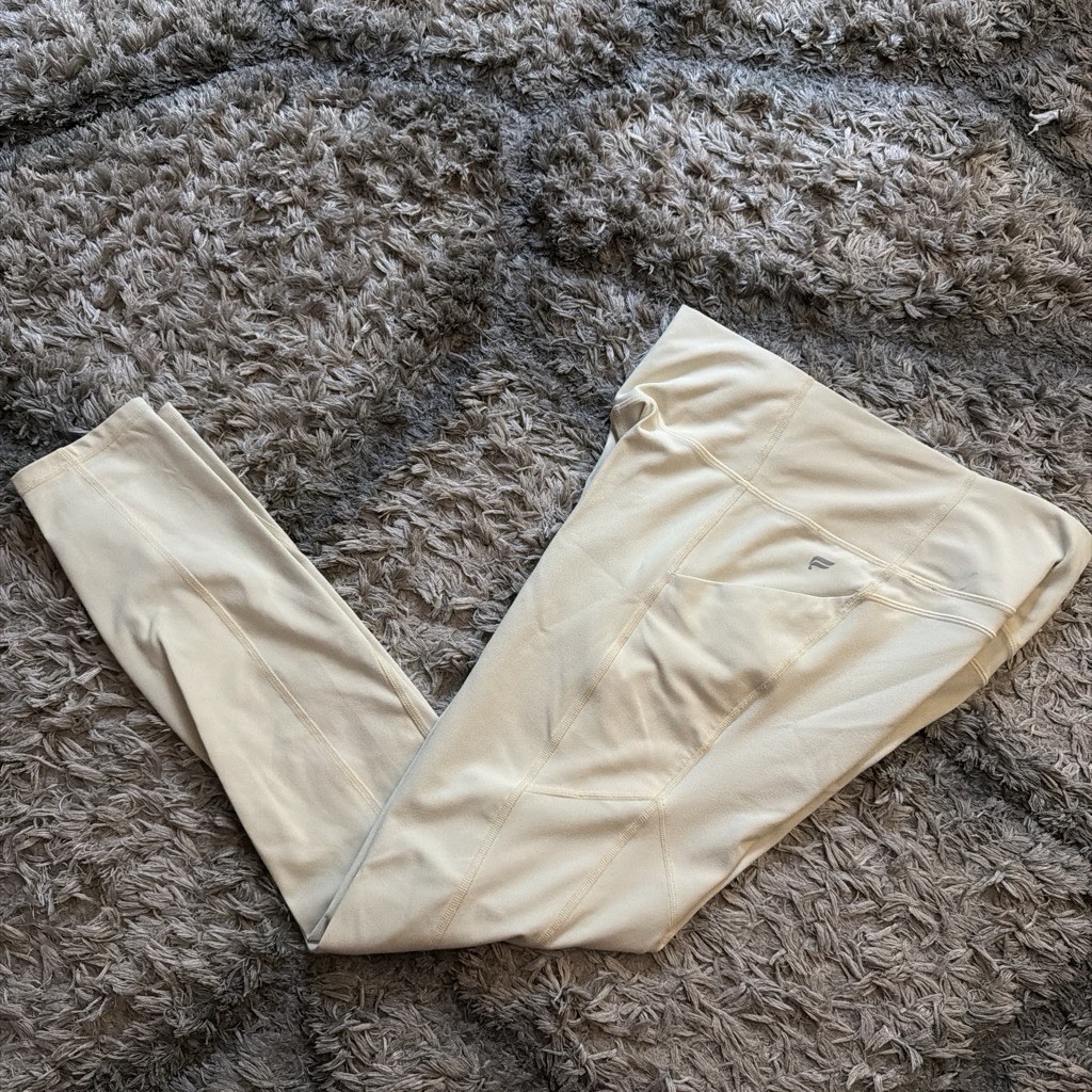 Light yellow Fabletics pureluxe leggings with pockets size Medium