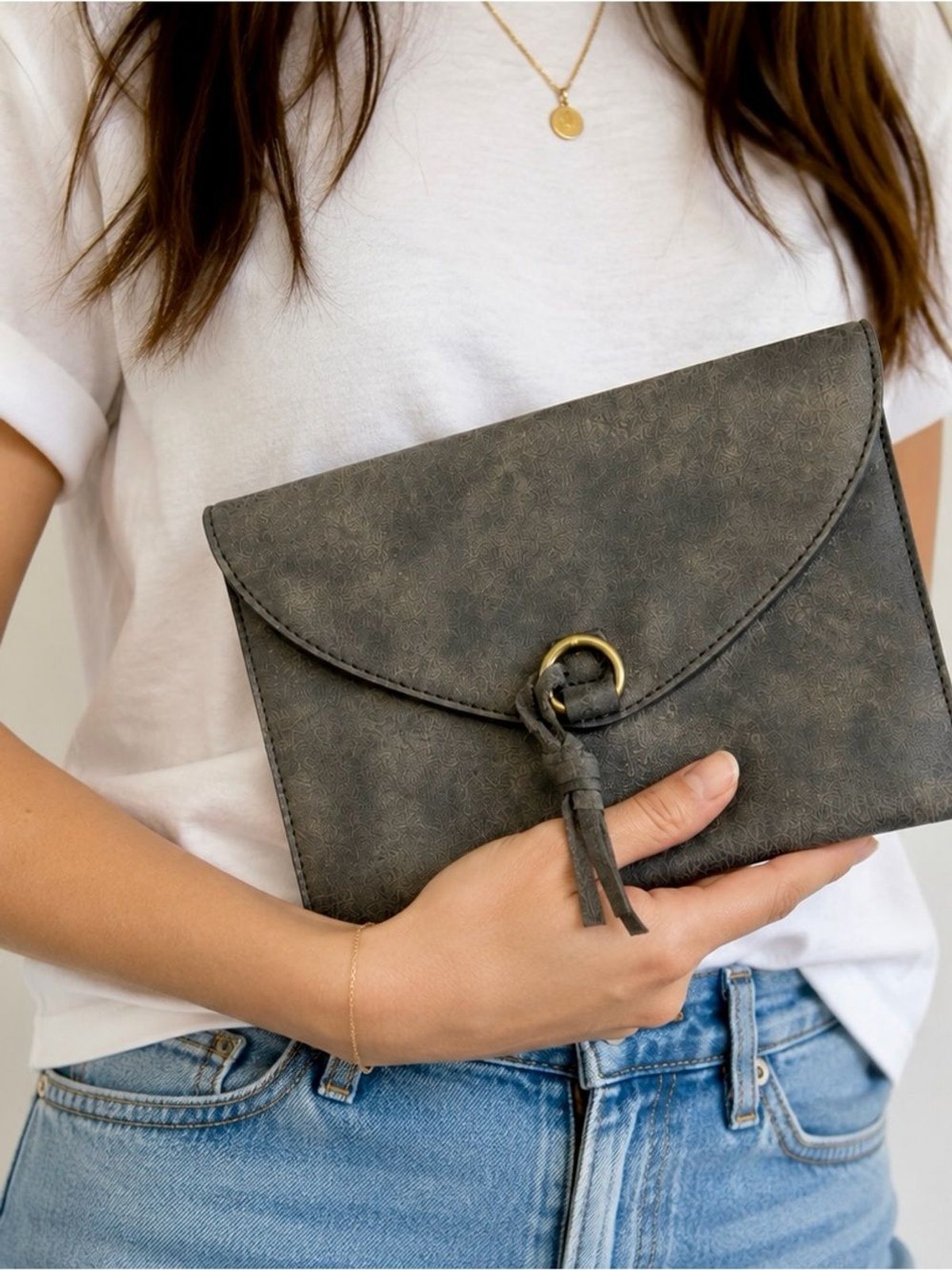 Anthropologie gray faux leather envelope clutch with gold ring and tassel