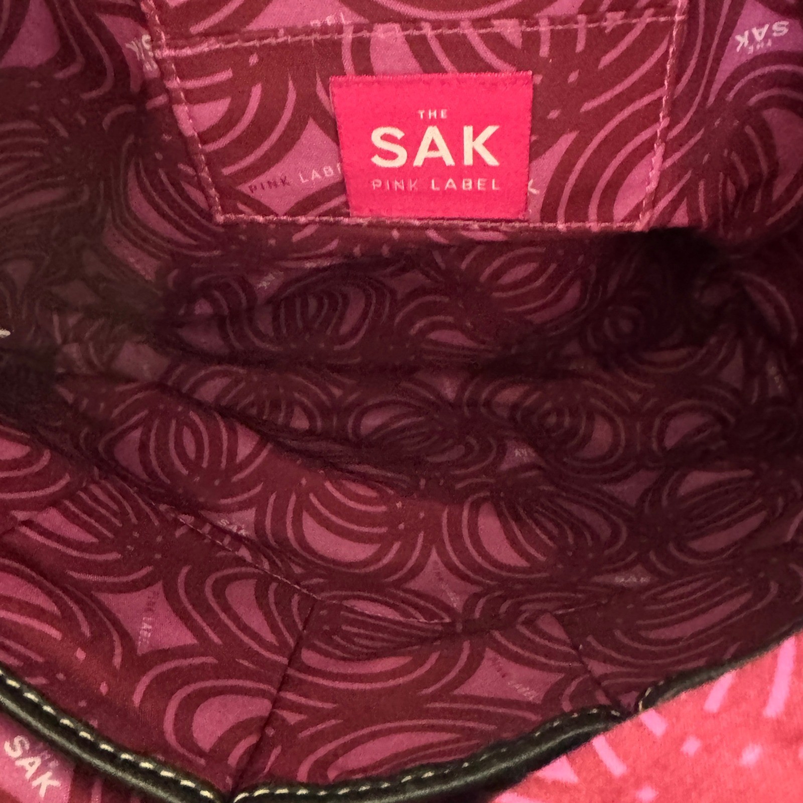 The Sak Black Leather Tote Bag With White Stitching And Tassel Accent Timeless