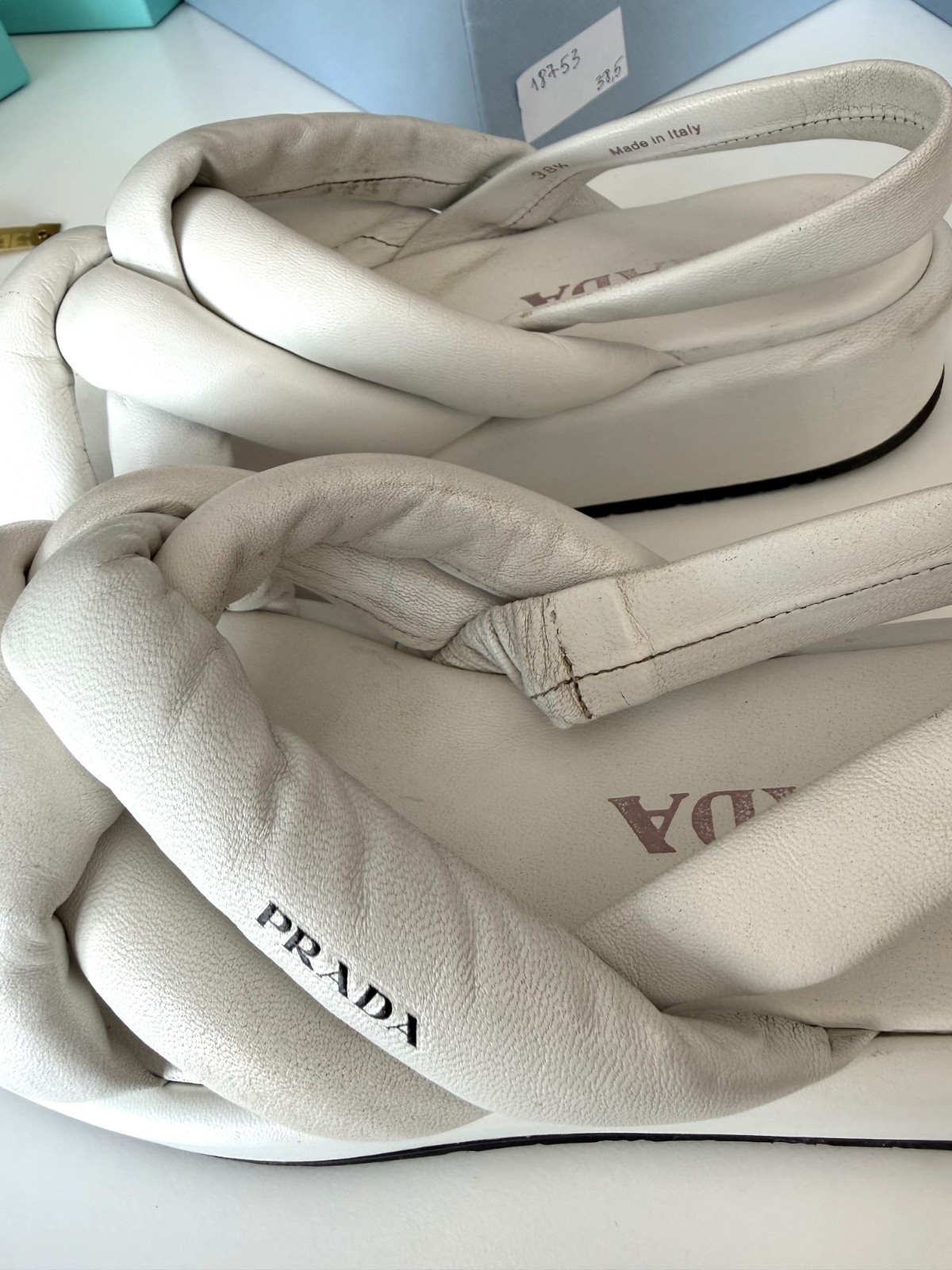 Women’s PRADA Padded Nappa Leather Flatform Sandals in white. Size: 38.5 EU