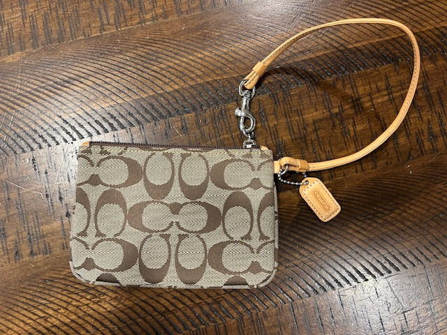 Coach Wristlet Beige with 2-way strap. 6″ wide x 4.5″ tall. Gold/Tan/Brown