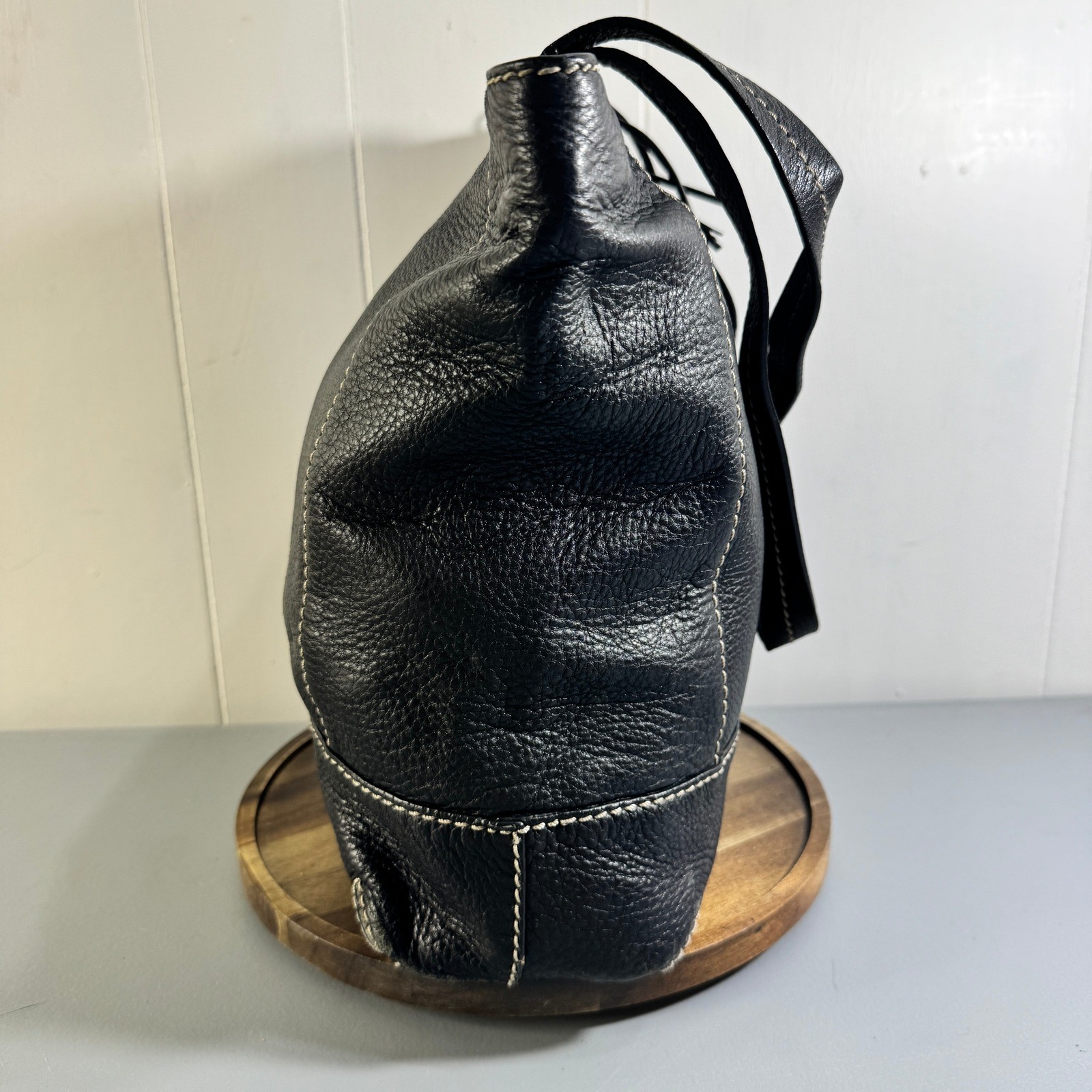 The Sak Black Leather Tote Bag With White Stitching And Tassel Accent Timeless