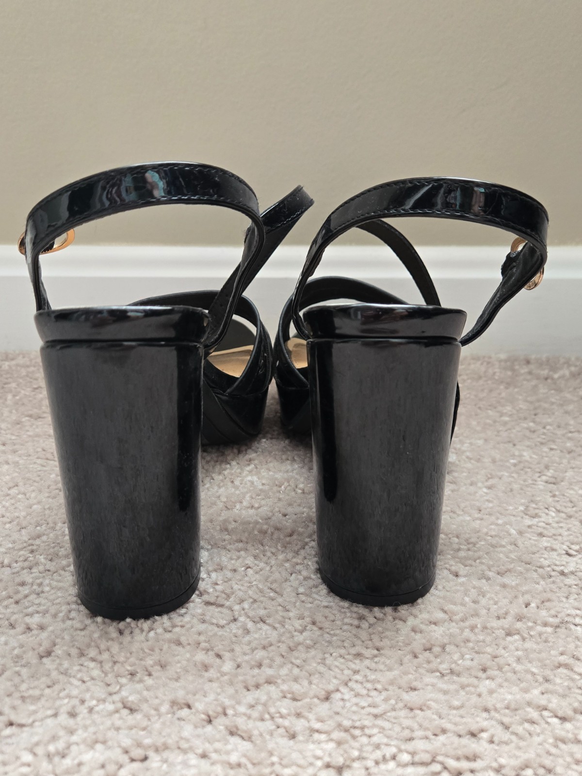 Brand new. Size 6.5. Never worn. Black faux leather. Strap
