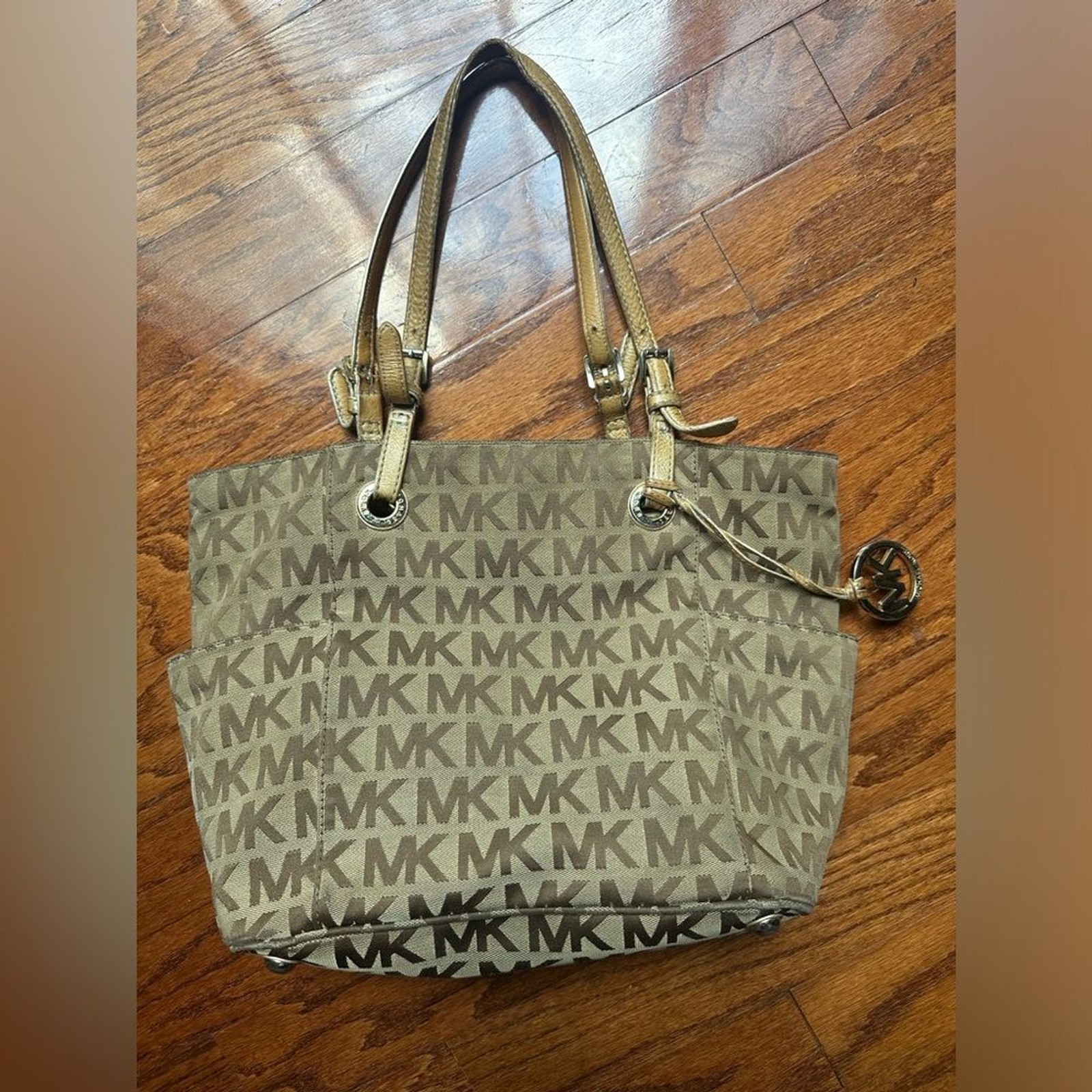 Michael Kors Jet Set tote the brand’s signature monogram canvas & gold hardware