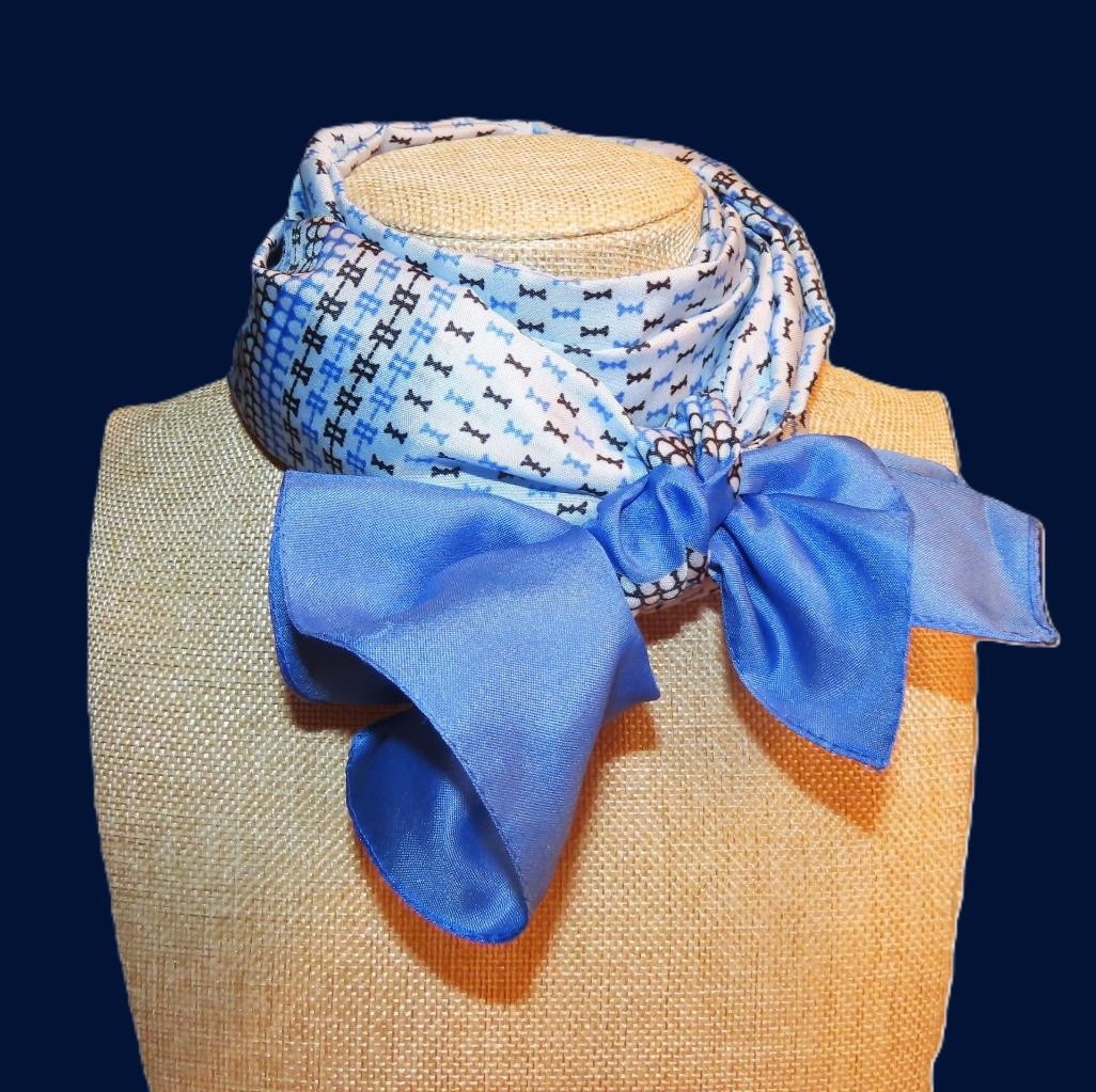 Oblong abstract scarf; blue tones, white; polyester; 54 x 10.5 inches