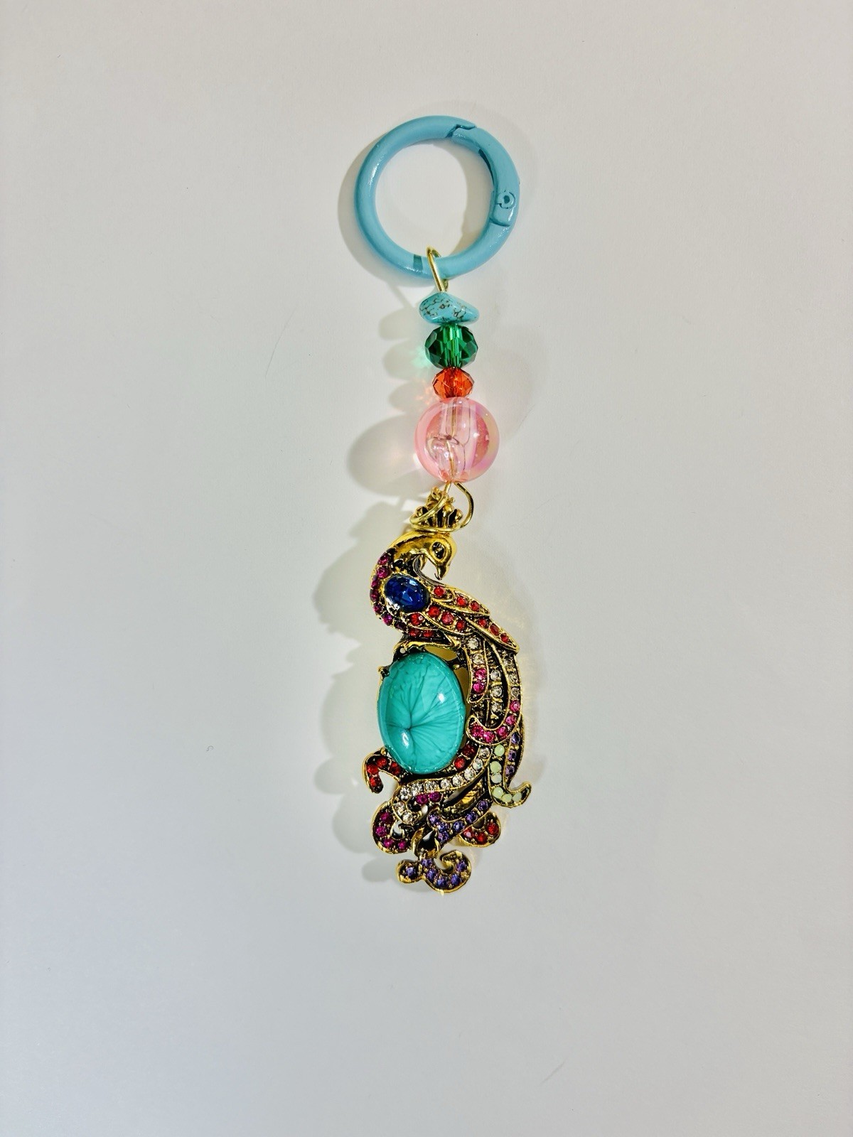 Elegant Peacock Charm Keychain – Gold Tone with Matching Beads