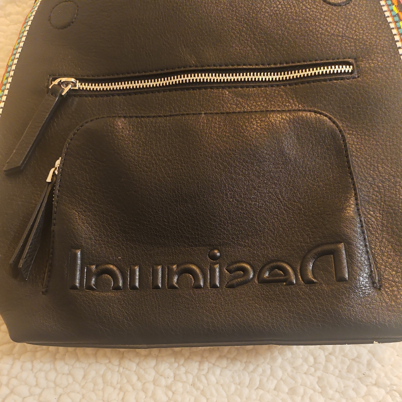 Midsize backpack,multicoloured embroidery,magnetic flap closure, zip, pockets.