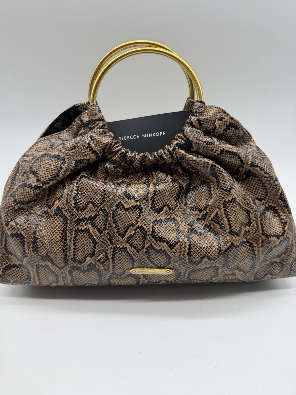 REBECCA MINKOFF Madeleine snake print round handle small satchel – Brown