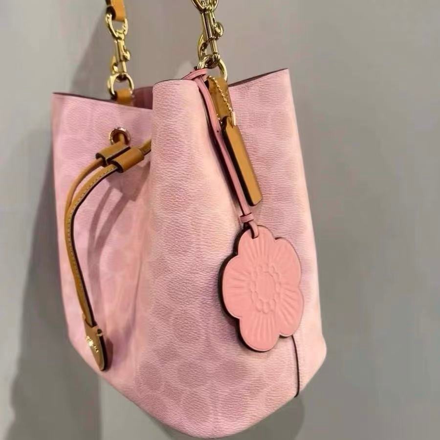 Coach CEA23 Rowan Bucket Bag In Signature Canvas With Charms Powder Pink NWT