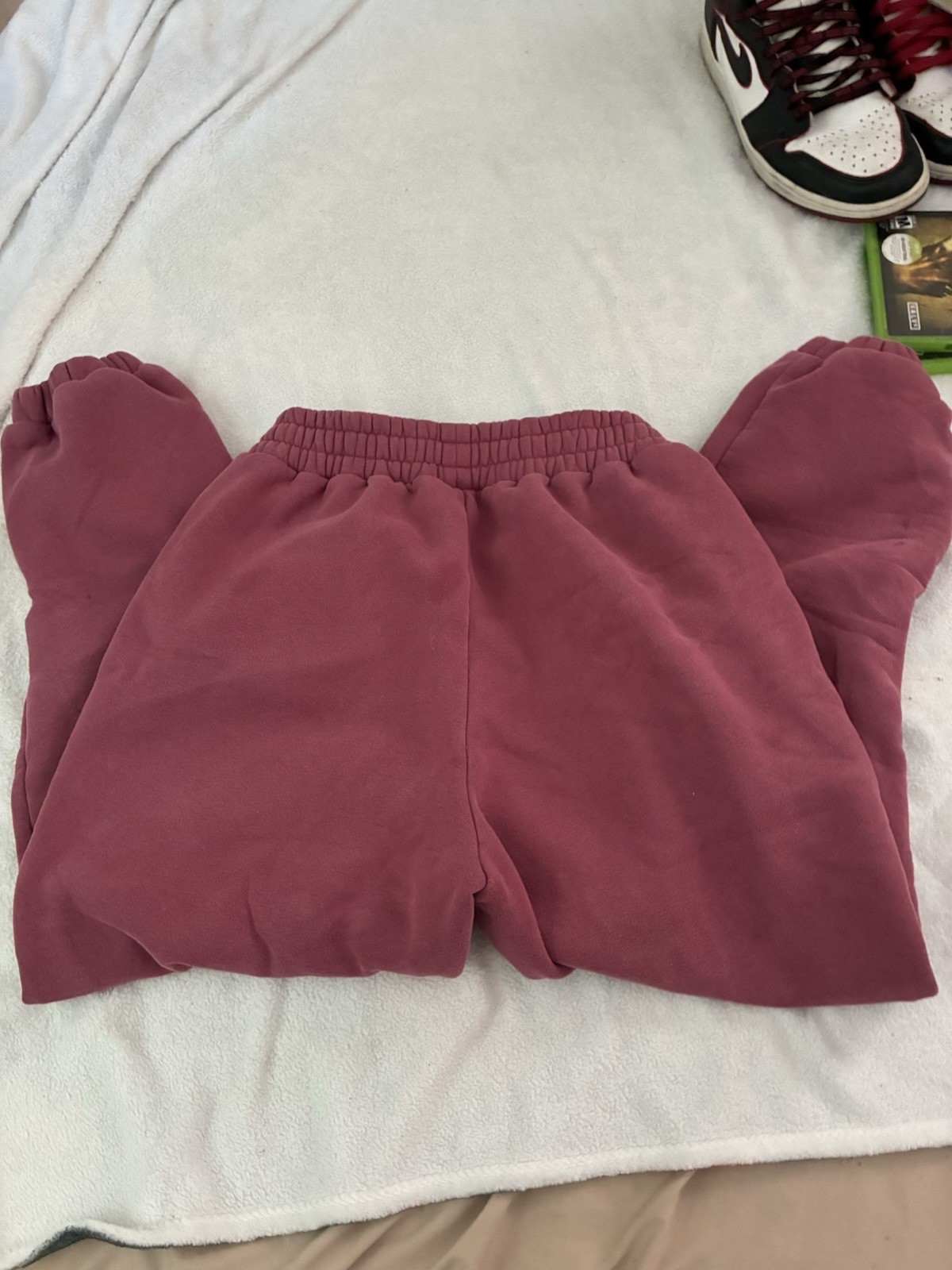 Comfrt Minimalist Sweatpants, Berry Color, Size M. Small bleach stain as shown.