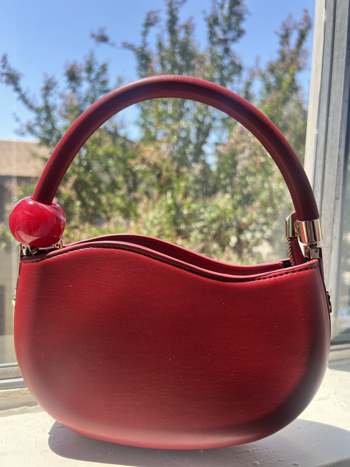 Melie Bianco Red Crescent Top Handle Bag Solid Gold Hardware Zip Closure Cross