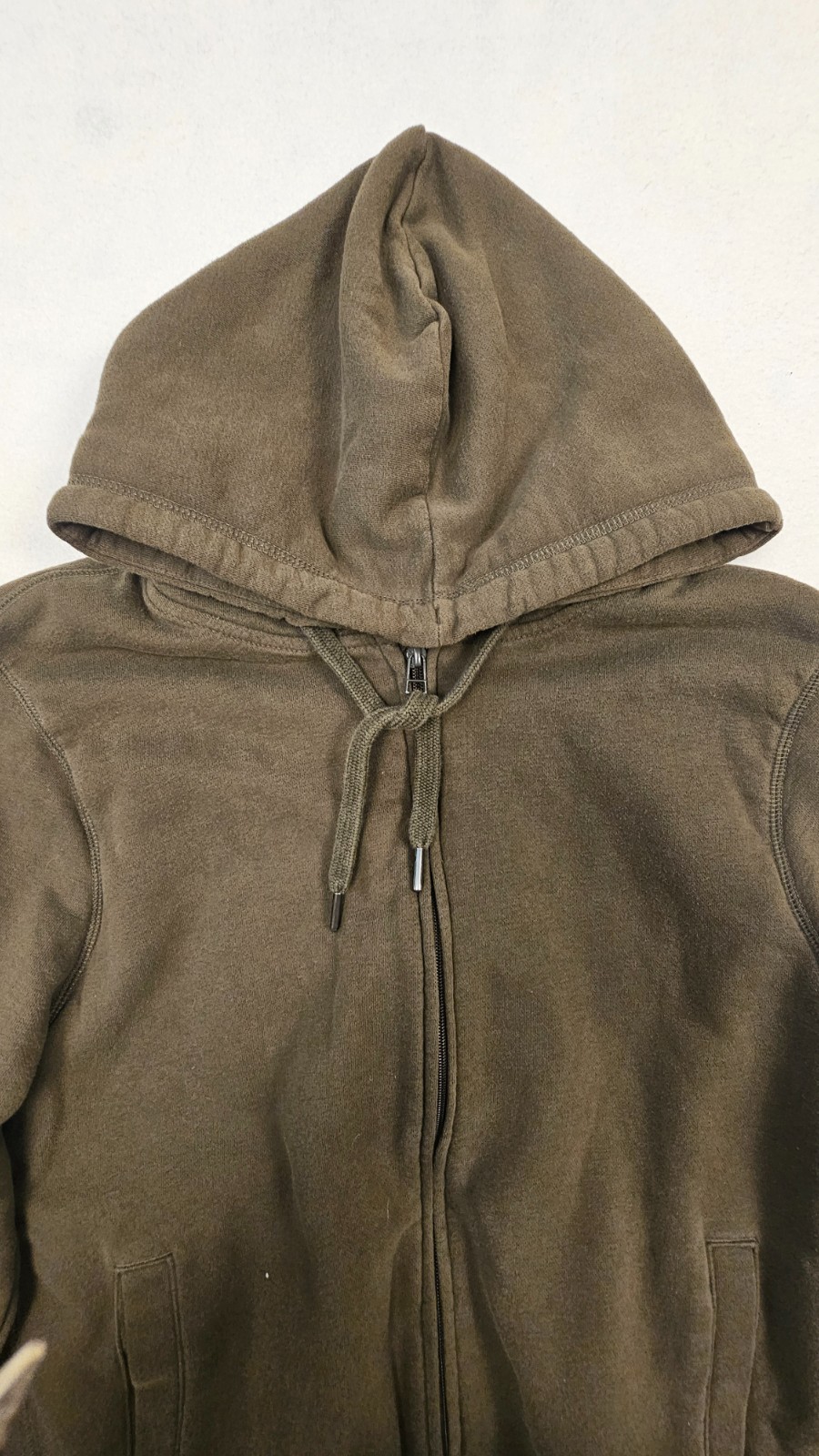 olive green full-zip hoodie features a cozy fleece lining, an adjustable drawstr