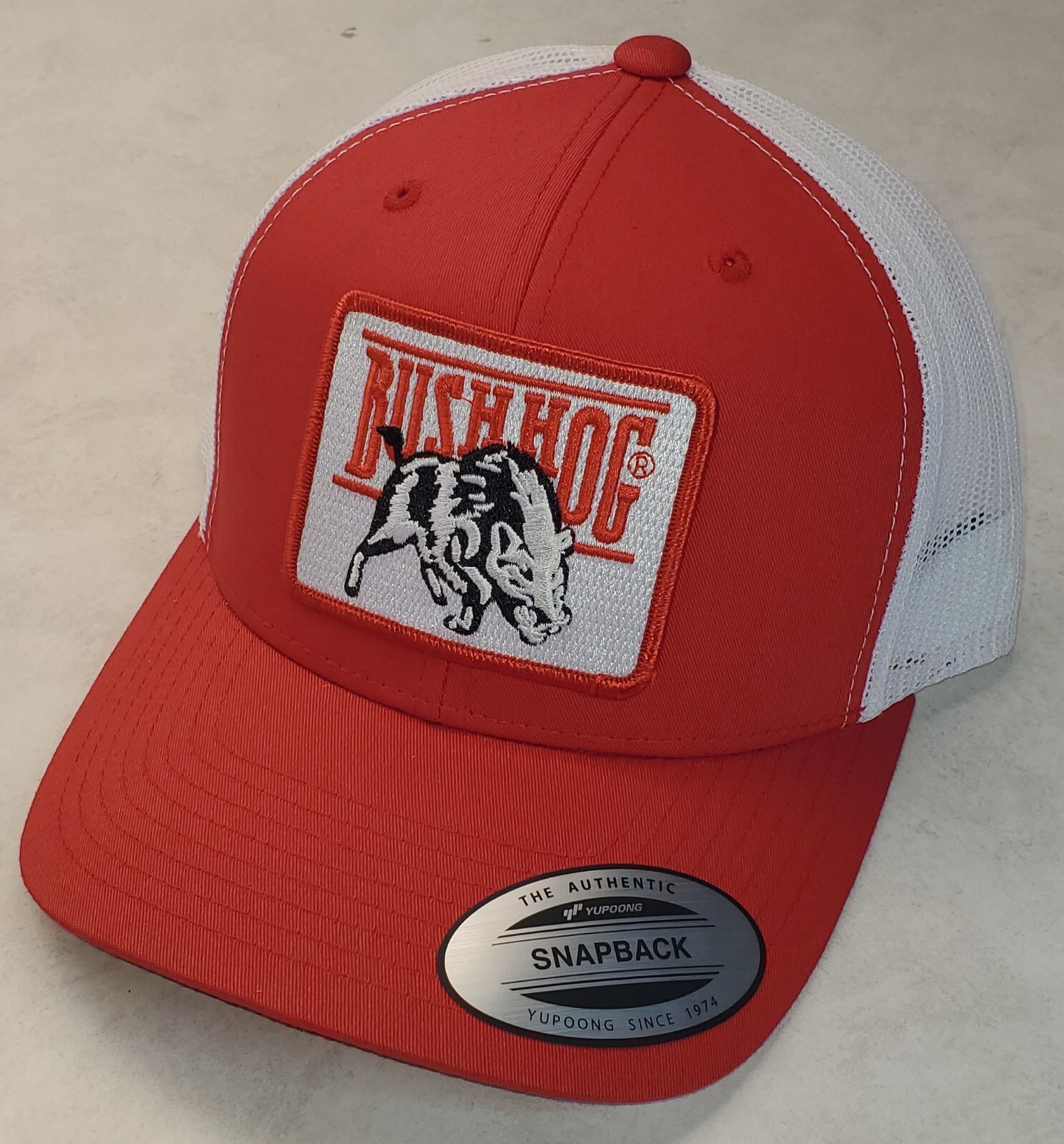 Bush Hog Patch on Yupoong 6606 Classics Trucker Hat Snapback Red/White