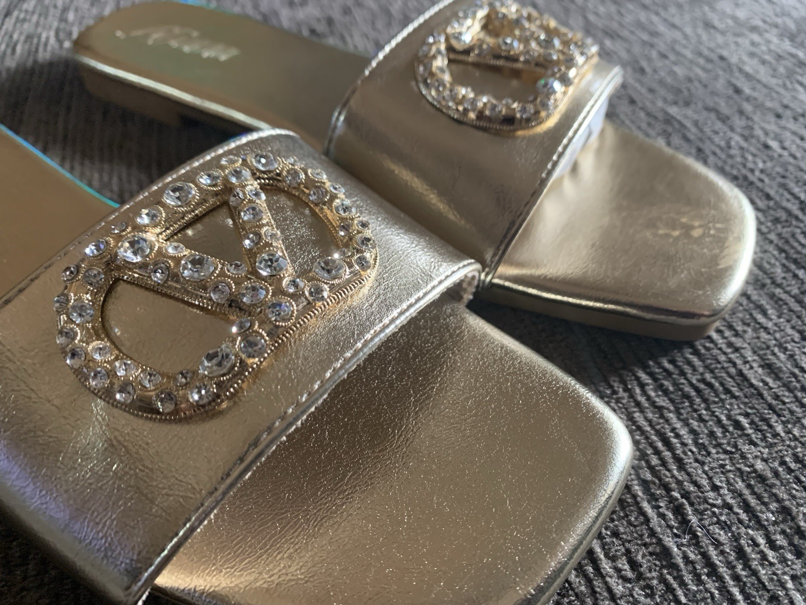 Liliana Rhinestone logo slide in gold.