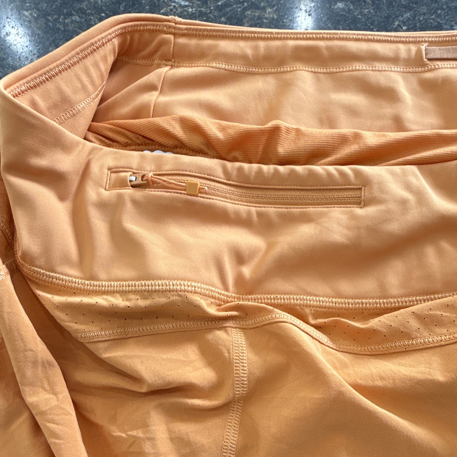 Athleta Women’s Run With It Orange 3.5in Running Shorts Zip Pockets Stretch