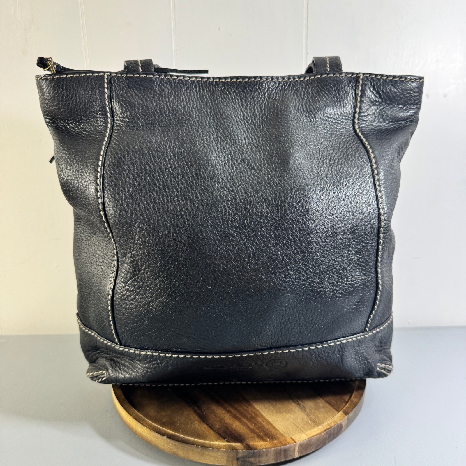 The Sak Black Leather Tote Bag With White Stitching And Tassel Accent Timeless