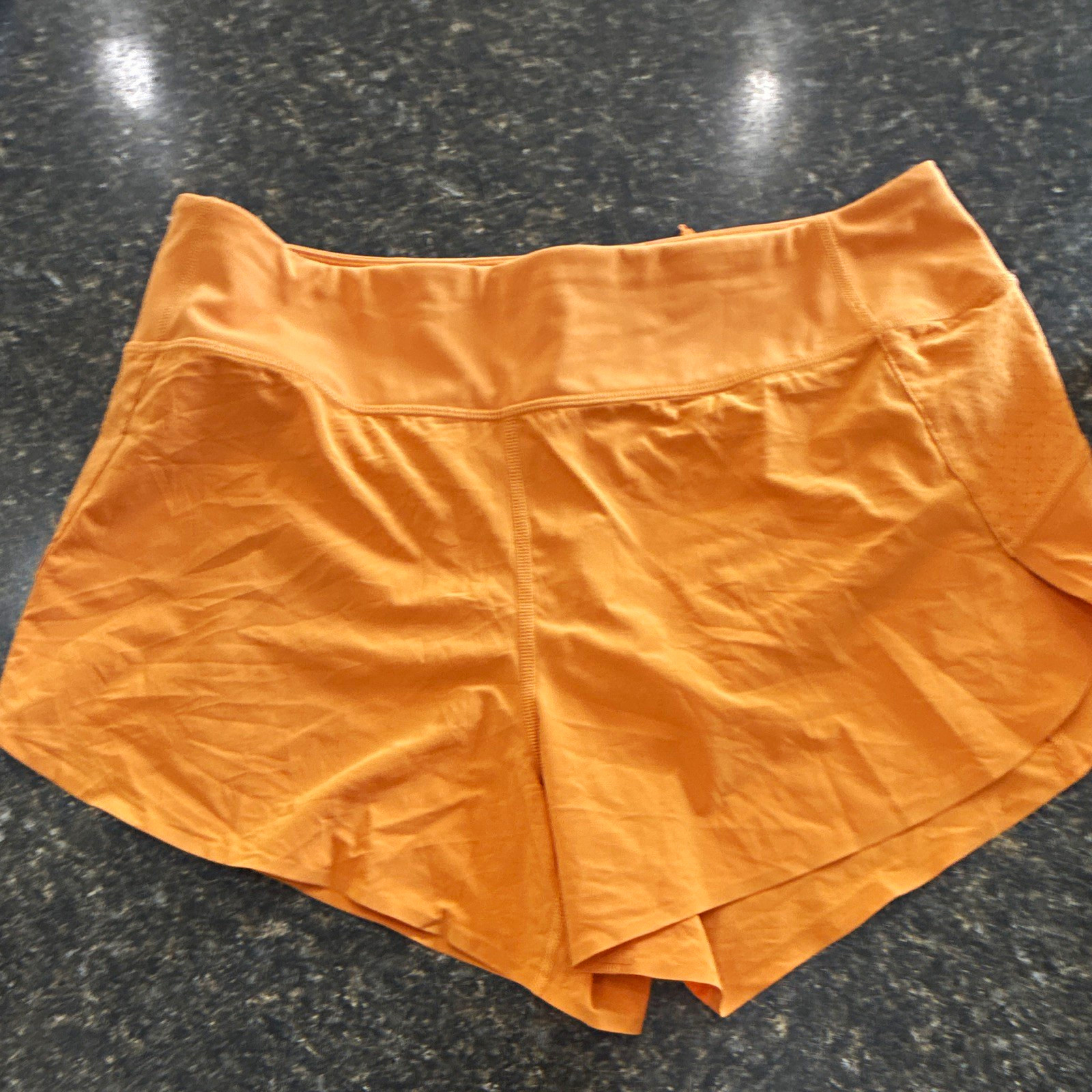 Athleta Women’s Run With It Orange 3.5in Running Shorts Zip Pockets Stretch
