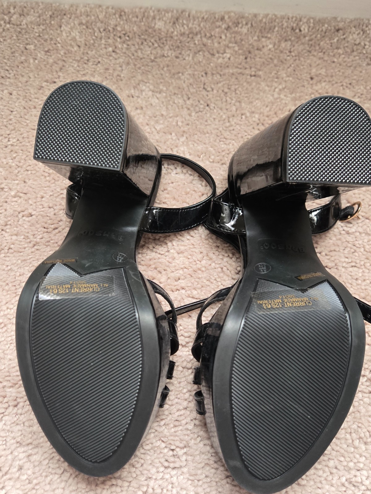 Brand new. Size 6.5. Never worn. Black faux leather. Strap