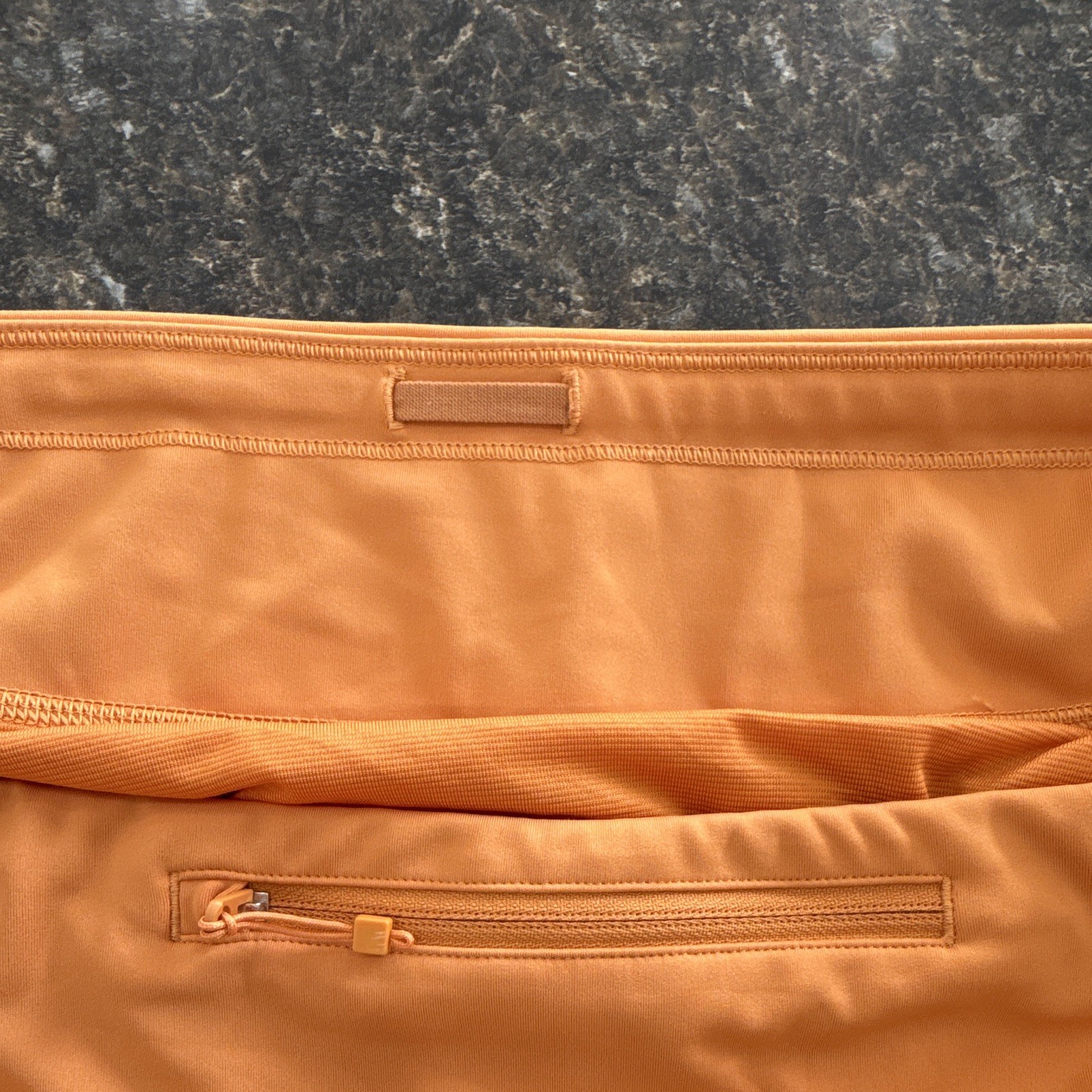 Athleta Women’s Run With It Orange 3.5in Running Shorts Drawstring Pockets