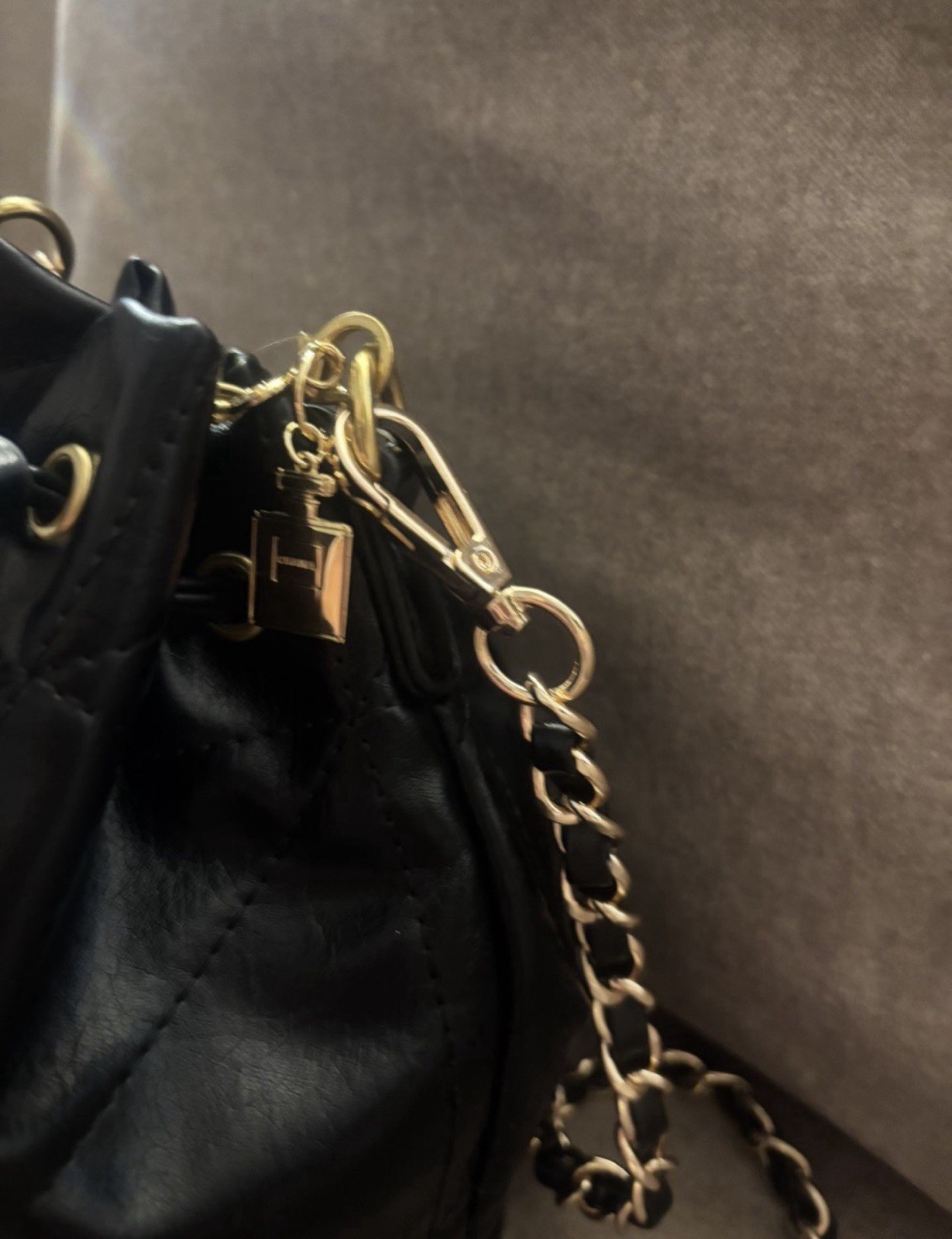 CHANEL Mini Black Quilted Drawstring Bucket Bag with Gold Chain Strap Charm