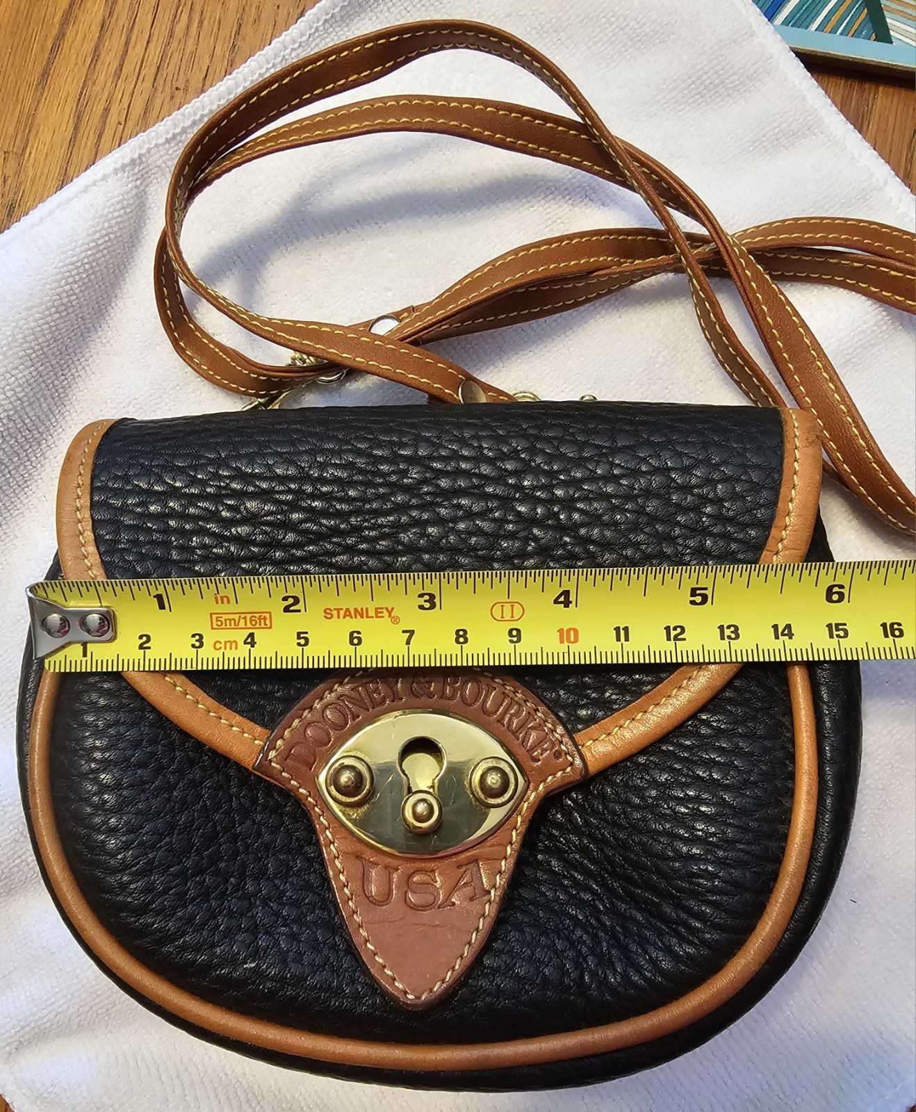 Dooney & Bourke Calvary Black/Brown Crossbody, Gold Hardware Charm.