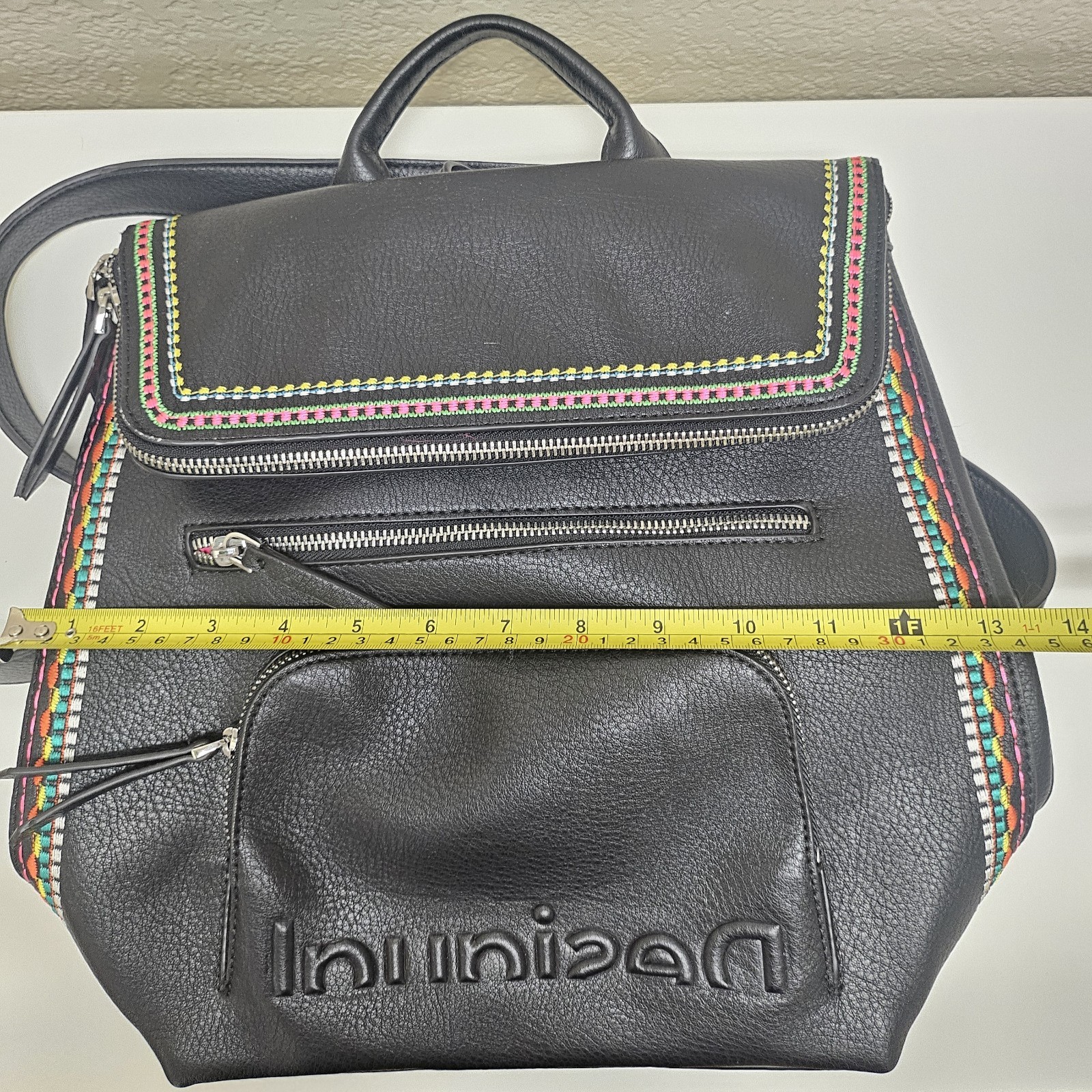 Midsize backpack,multicoloured embroidery,magnetic flap closure, zip, pockets.