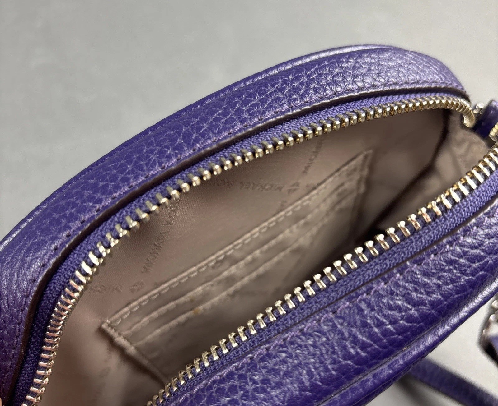 Michael Kors Purple Pebbled Leather Small Oval 7.75″x5.5″ Crossbody Bag w/Tassel