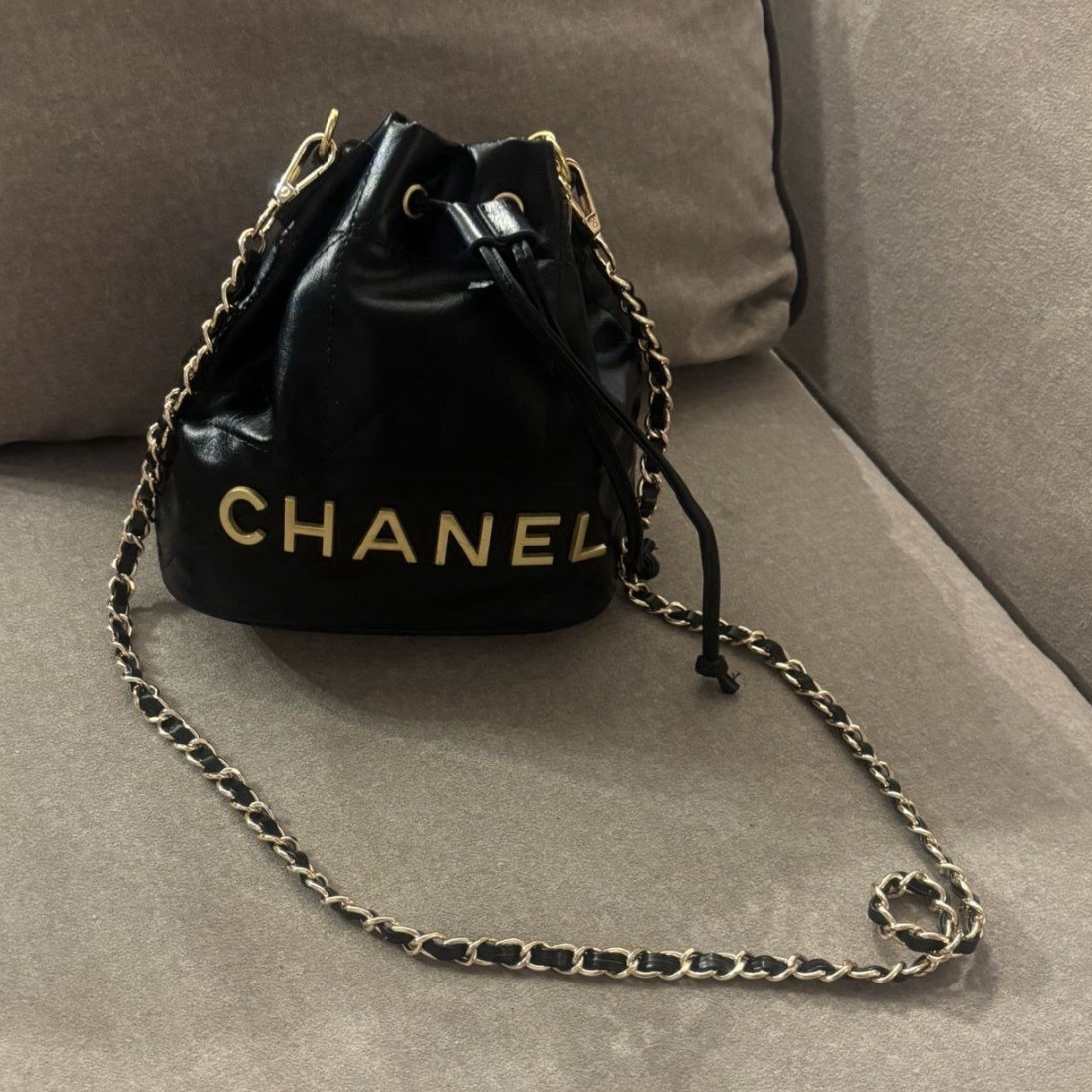 CHANEL Mini Black Quilted Drawstring Bucket Bag with Gold Chain Strap Charm