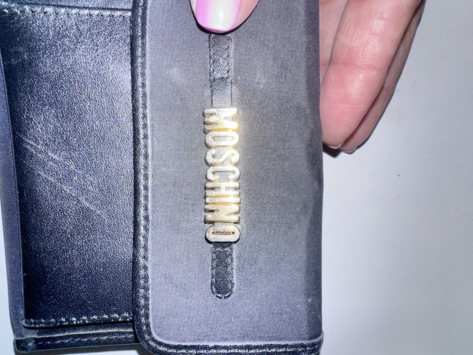 Vintage Moschino compact wallet, specifically a collaboration with Redwall