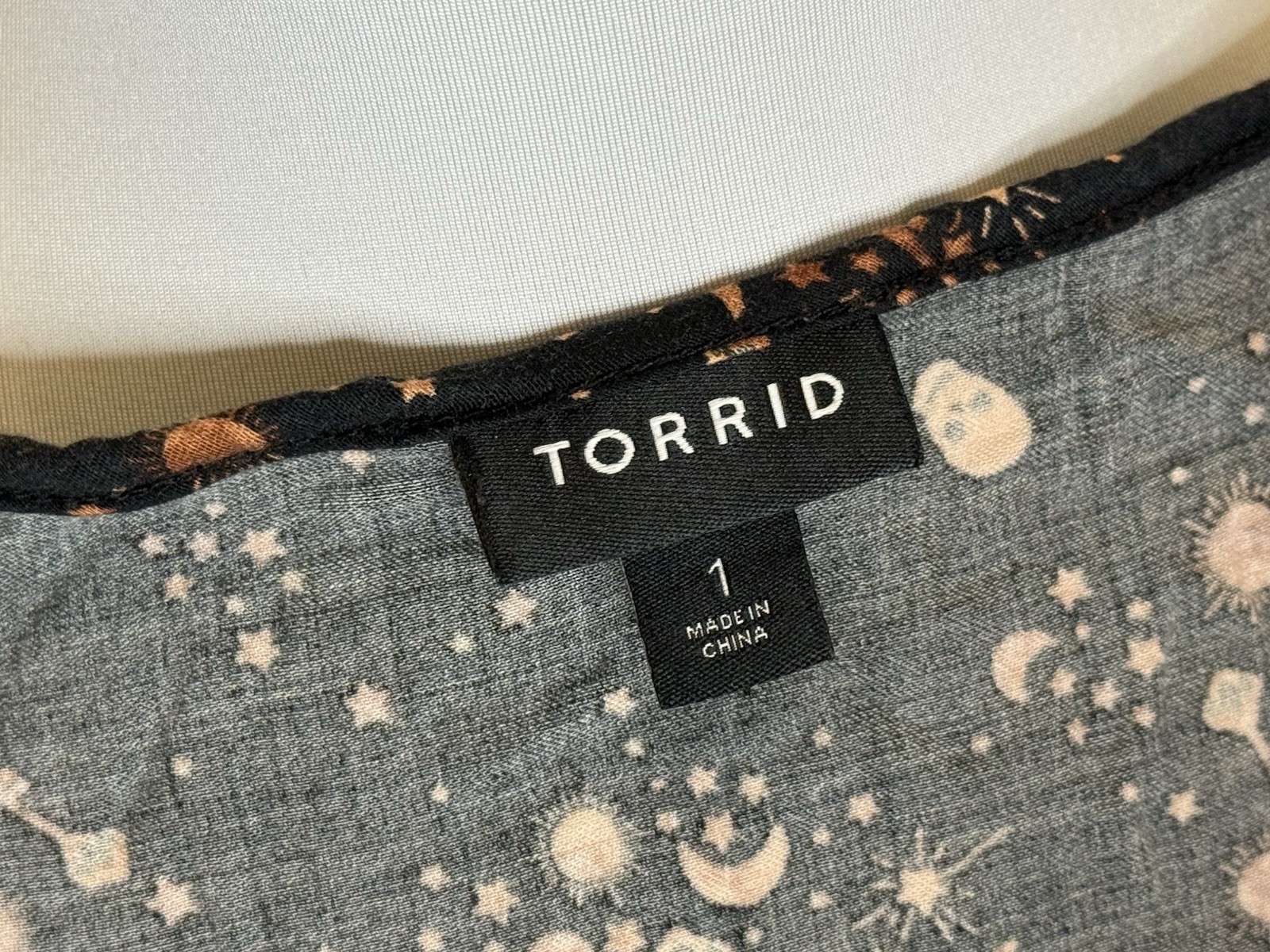 Torrid Woman’s Top Celestial Skulls Black Orange Halloween Size 1