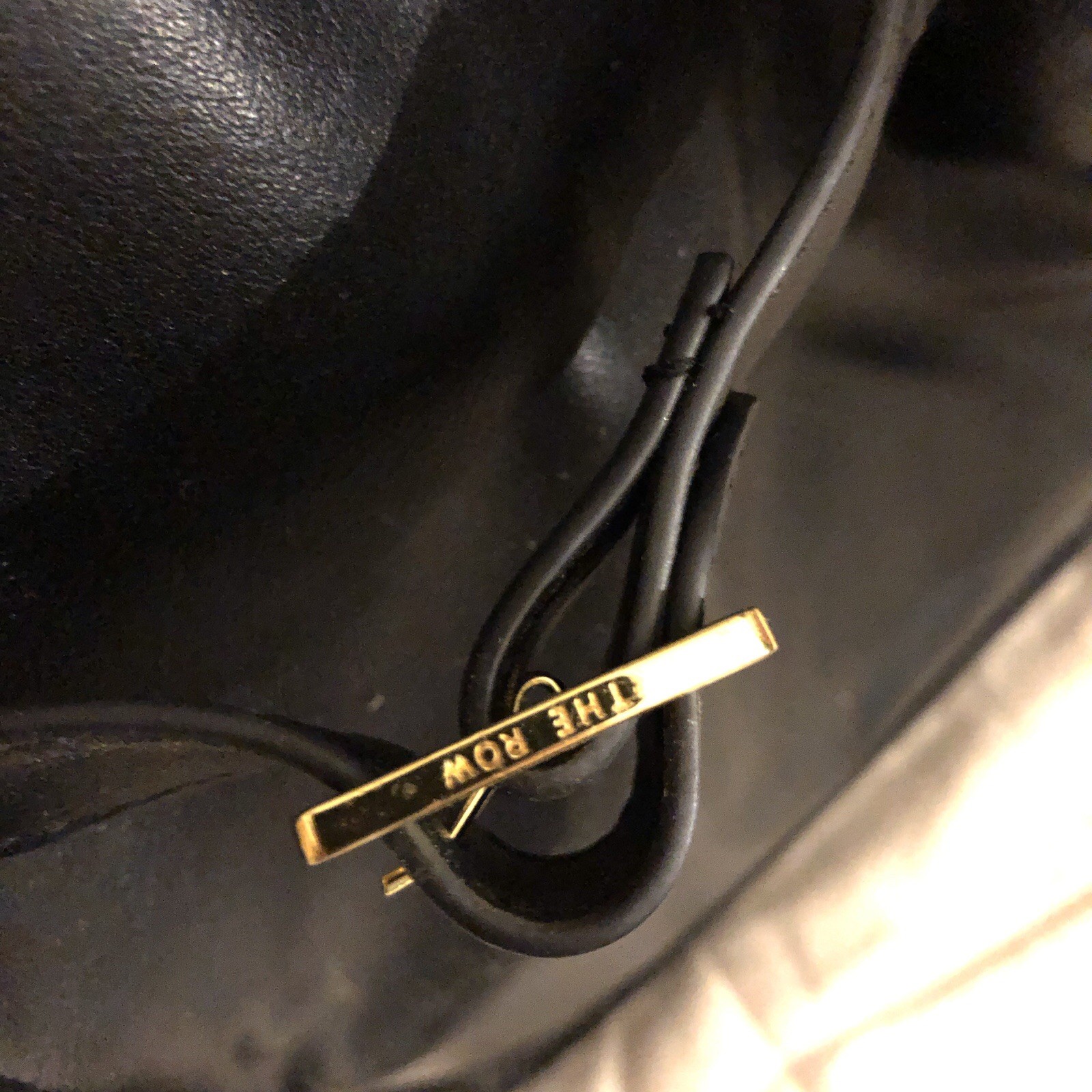 The Row Margaux 15 black with gold hardware