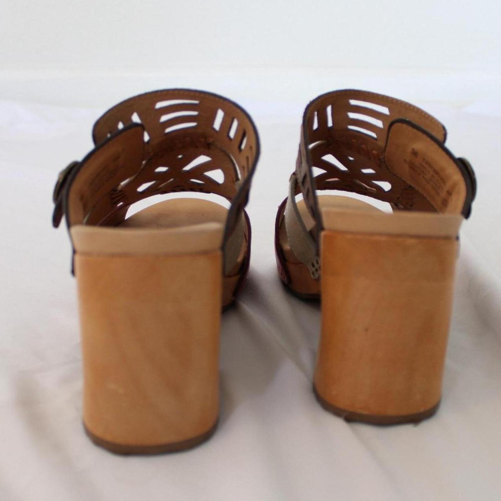 Dansko Oralee clogs with a leather upper with cut-out designs. size US 7.5-8