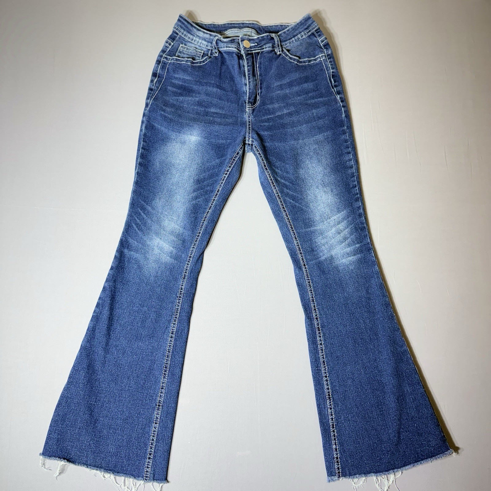 High Rise Flare Leg Jeans Frayed Hem Flap Back Pockets Medium Wash
