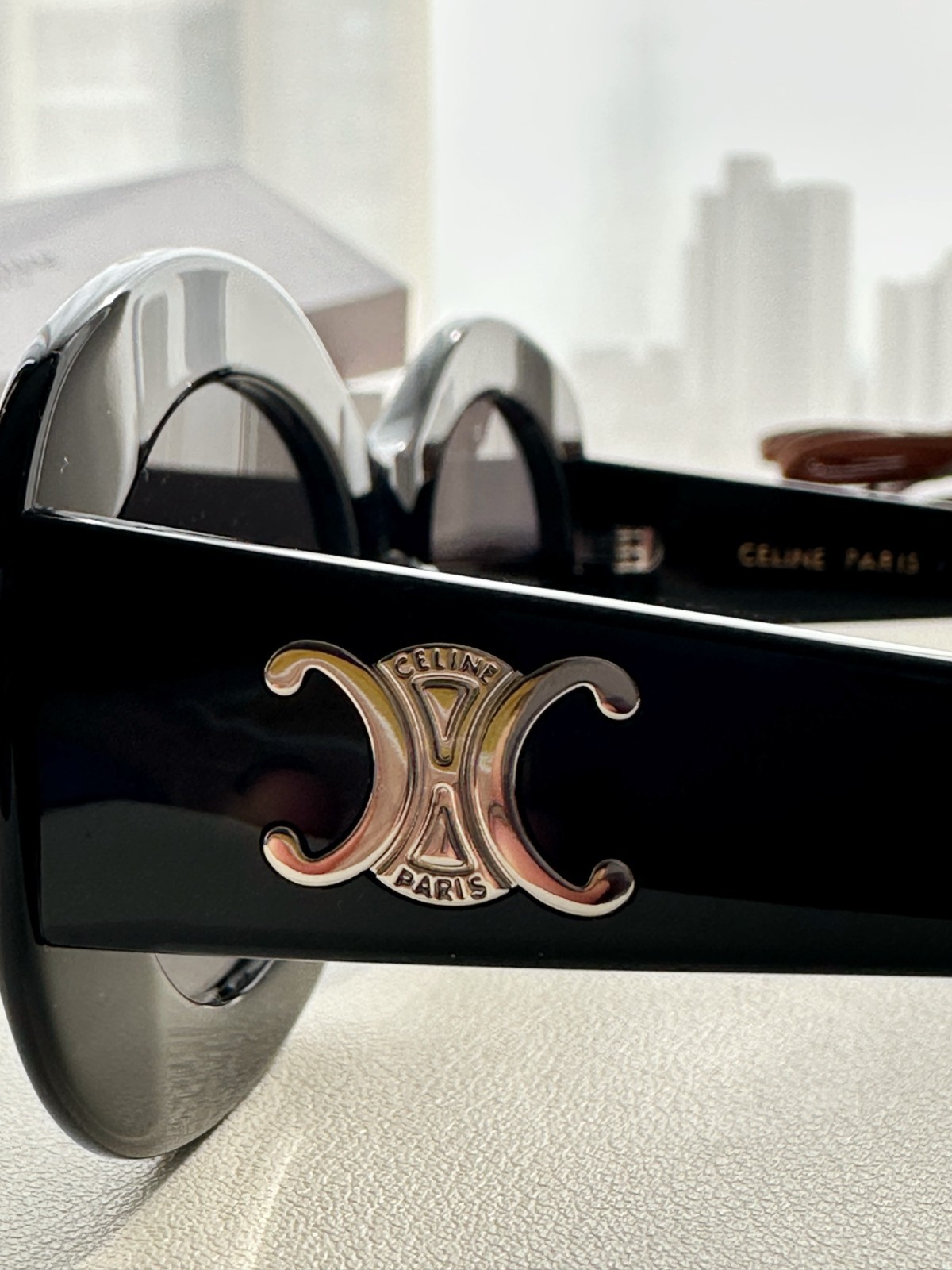 CELINE Iconic Triomphe Oval Sunglasses Black Frame Gold Logo Detail