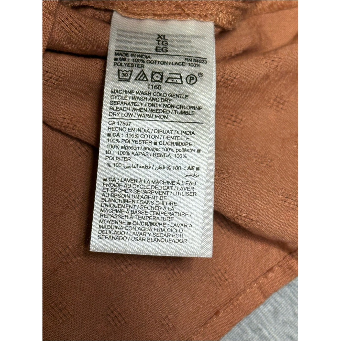Boho-chic Old Navy terracotta brown cotton eyelet blouse featuring puff sleeves