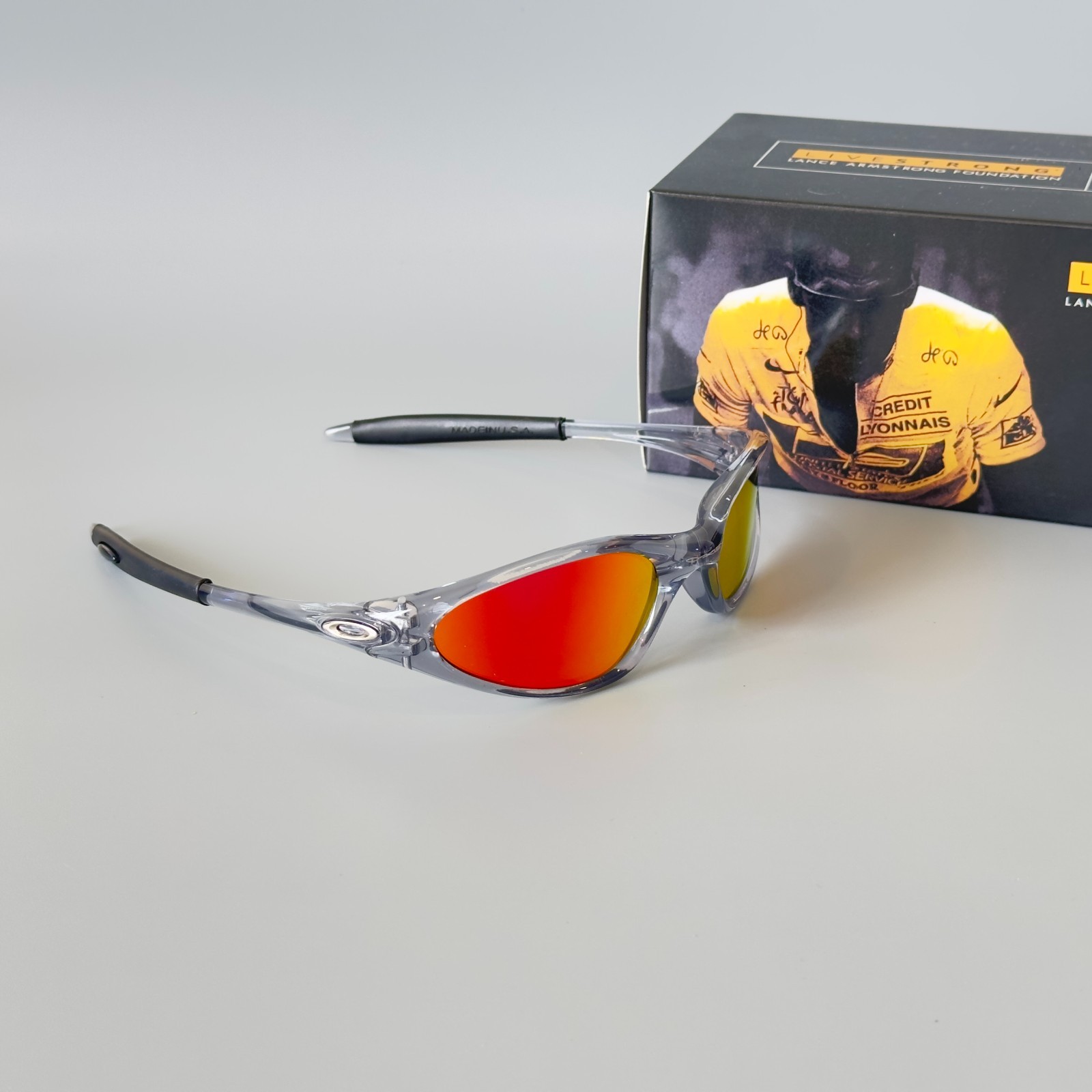 Oakley Minute Gen1 Minute 1.0 Sunglasses Transparent Gray Frame Red Lens